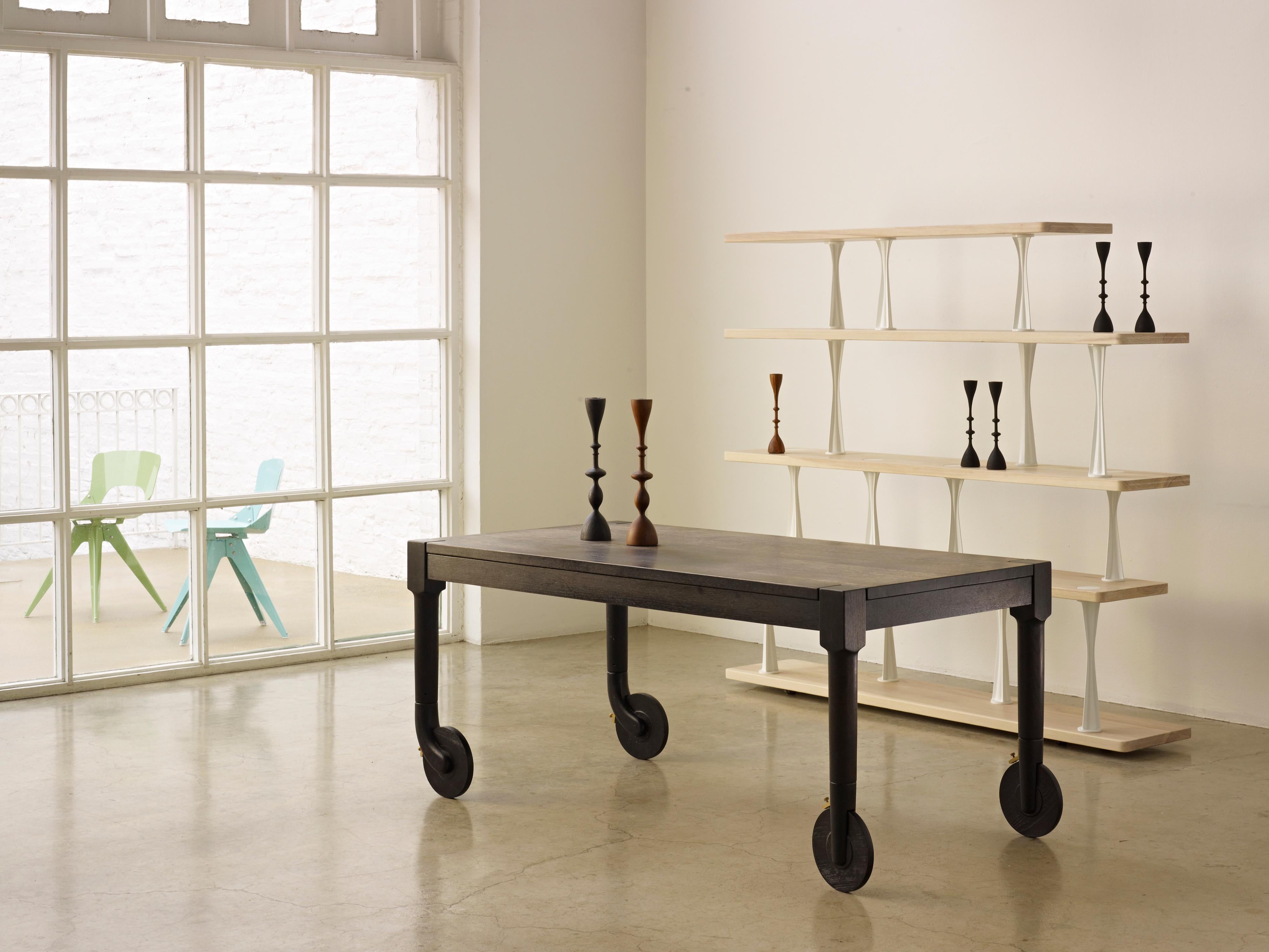 The Machine leg shelving System is a versatile design that pairs fully customizable solid wood shelves with sturdy cast aluminum vertical supports. The shelves are made to order at our studio in Chicago and are available in an extensive range of