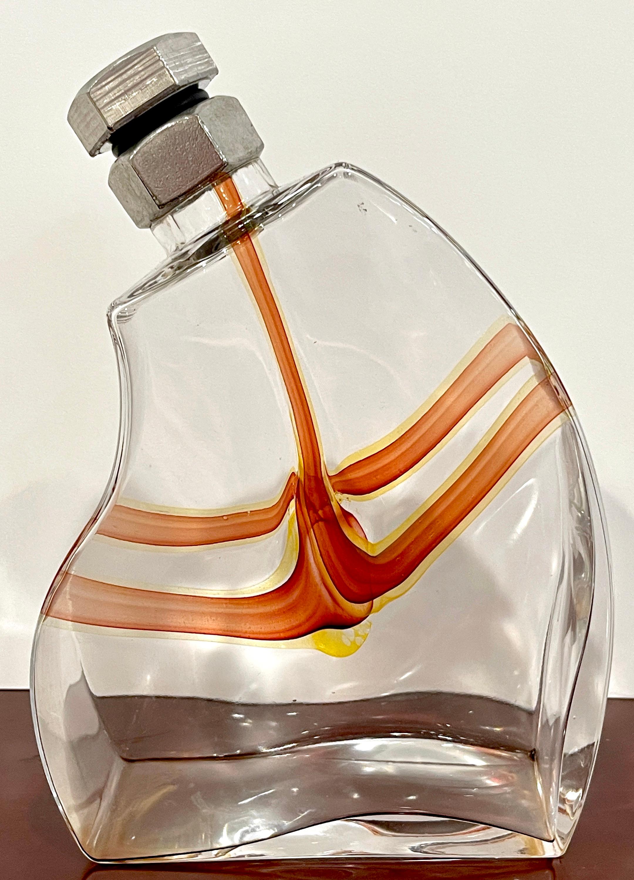 'Macho' Decanter by Kjell Engman for Kosta Boda 
Kjell Engman’s Macho Series 2000-2011

The 'Macho' Decanter by Kjell Engman for Kosta Boda is a stunning and iconic piece of glass artistry that belongs to Kjell Engman's acclaimed Macho Series, which