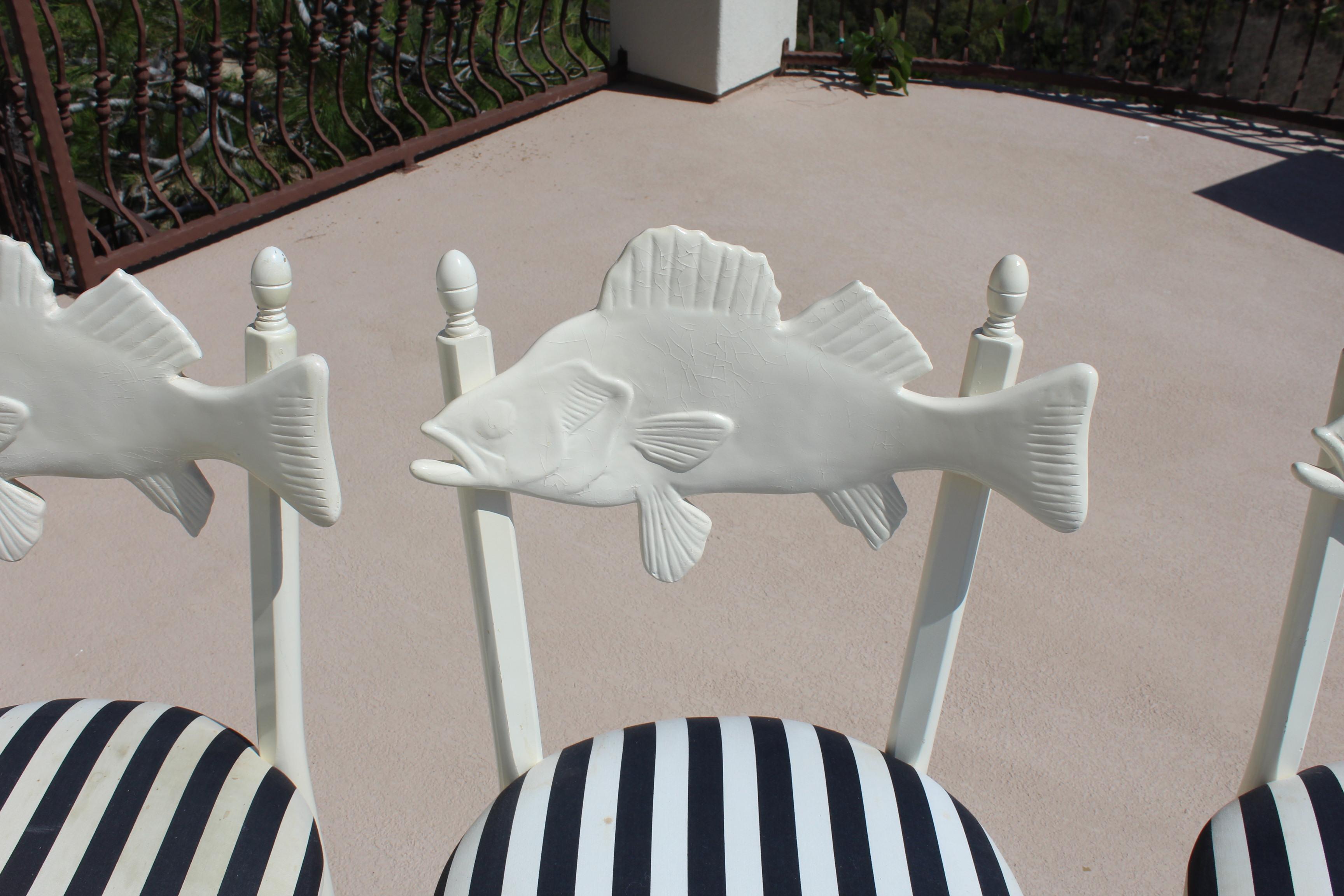This set of Four Bar Stools are from an earlier design and been in private holding for many years . They need to have some restorations done to the wood painted parts . One Fish has been damaged and put back together and another is pealing .  One