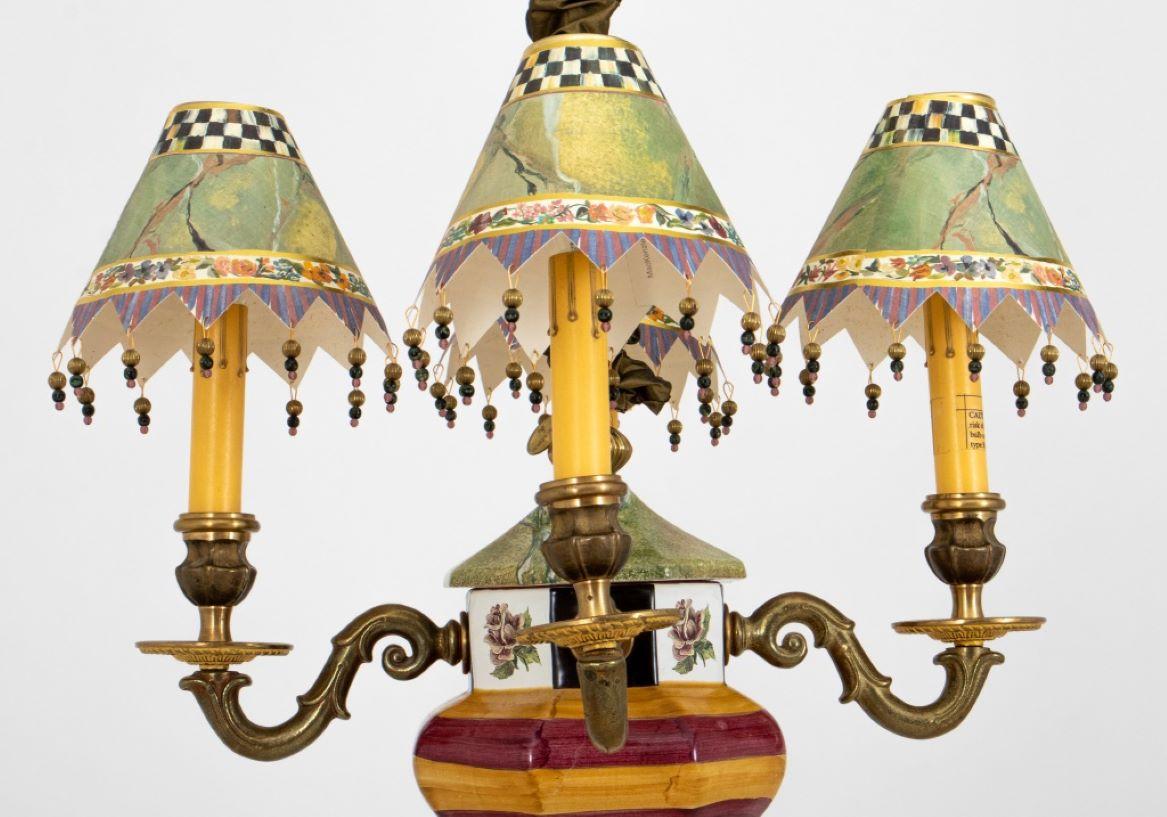 MacKenzie Childs Four Light Chandelier, in russet and toffee ceramic with scrolling brass arms and custom painted and beaded shades. 29