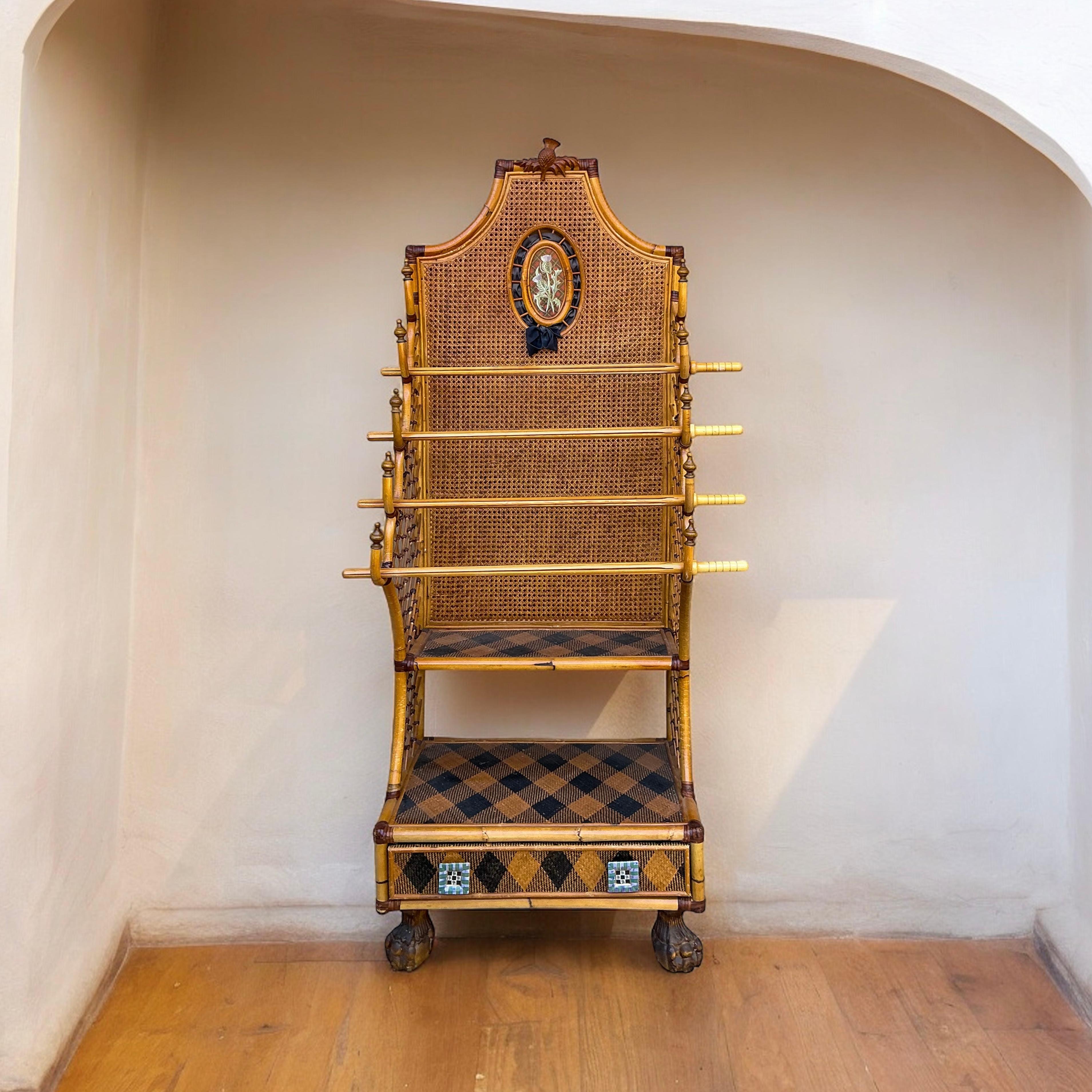 This is such a fun piece! This is Mackenzie-Childs hall tree or towel rack or even a magazine rack. I love the mix of leather bound bamboo and Scottish tartan accents. The double cane is in very good condition too. The denouement is it rests on a