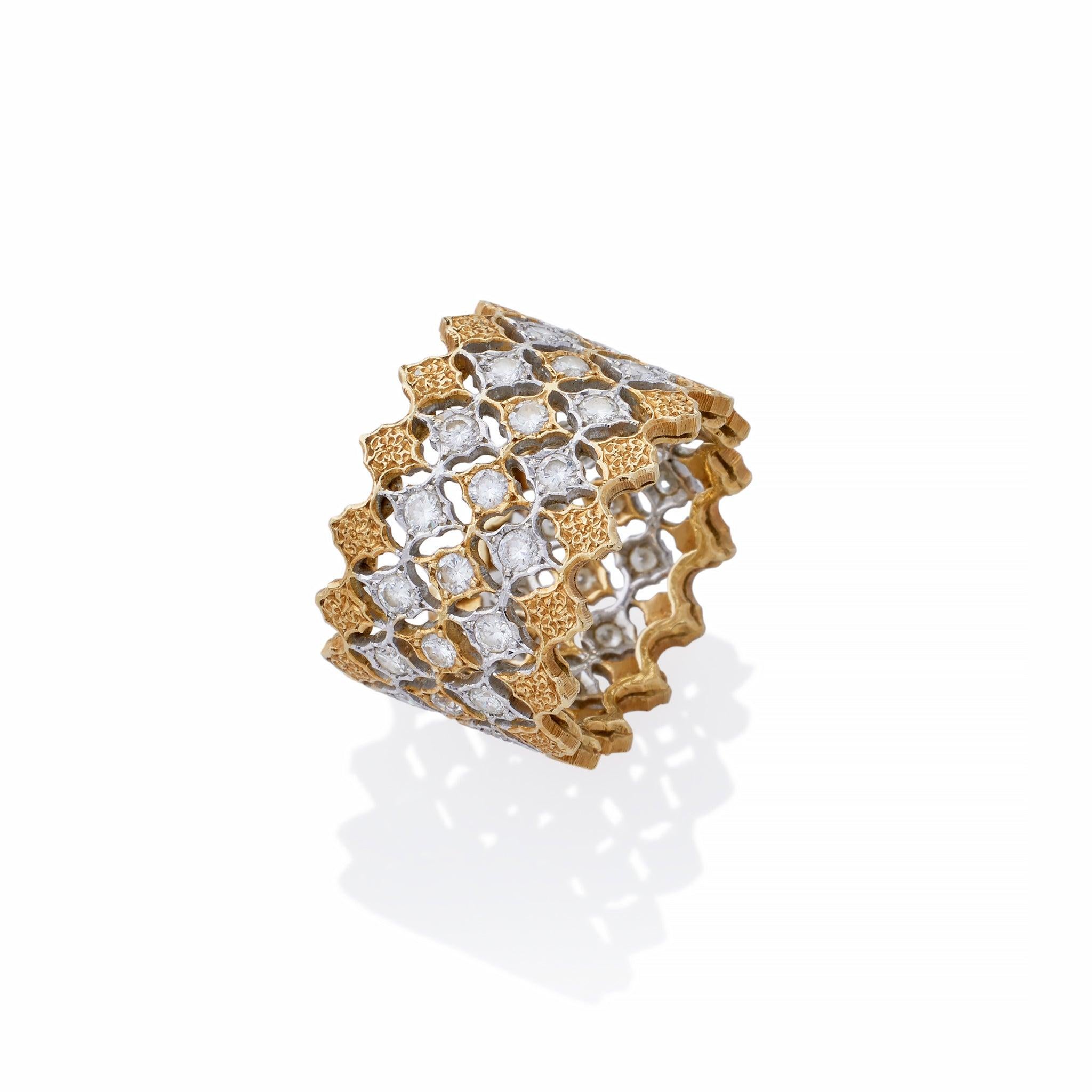 This modern diamond ring by Buccellati Milan is created of 18K bi-color gold and diamonds. The wide band is designed as a lightweight fretwork composed of three staggered rows of 
