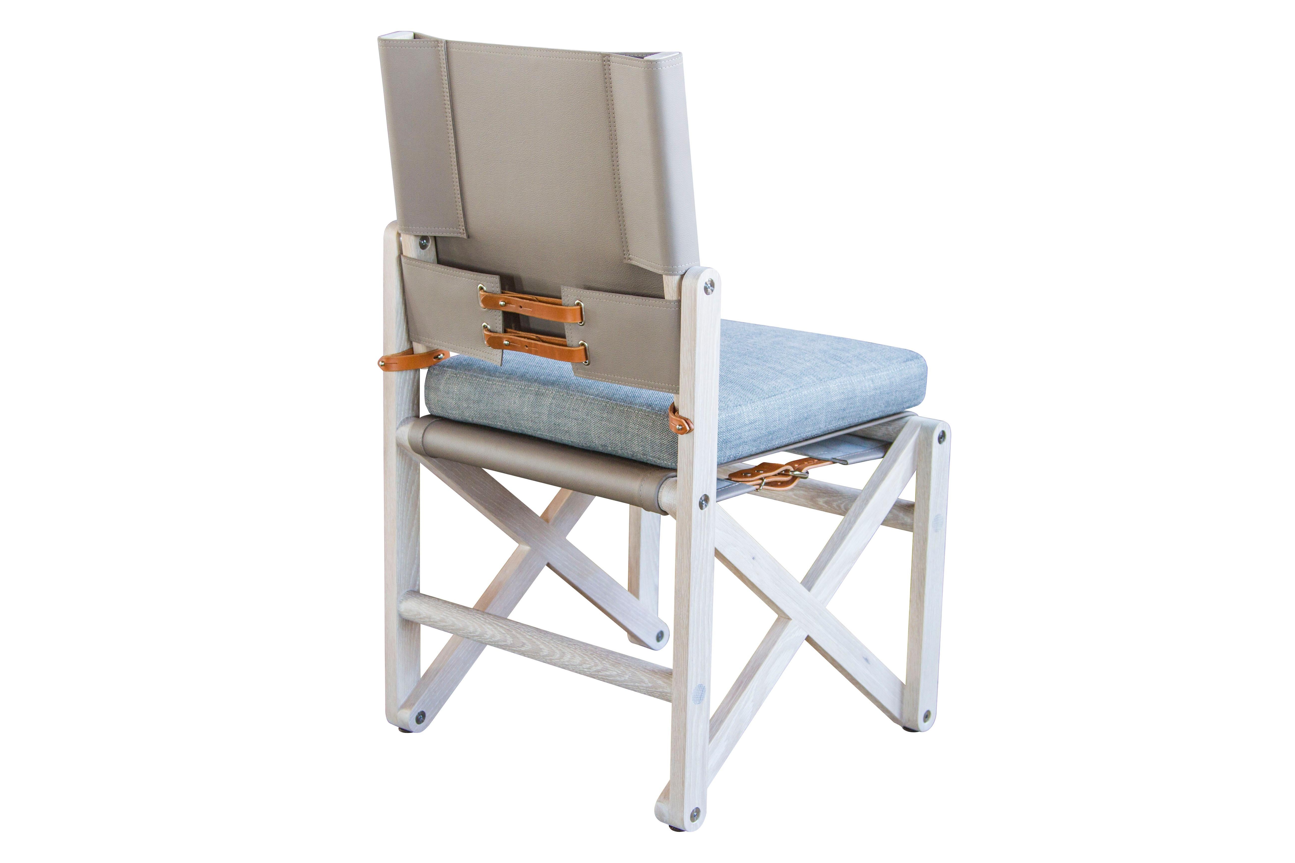 The MacLaren Dining Chair 02 (armless) shown here in Bleached White Oak with Moore & Giles: Dresden / Pewter leather back sling; Perennials Rough and Rowdy / Pumice fabric seat cushion and cognac English bridle leather strapping.

The modern