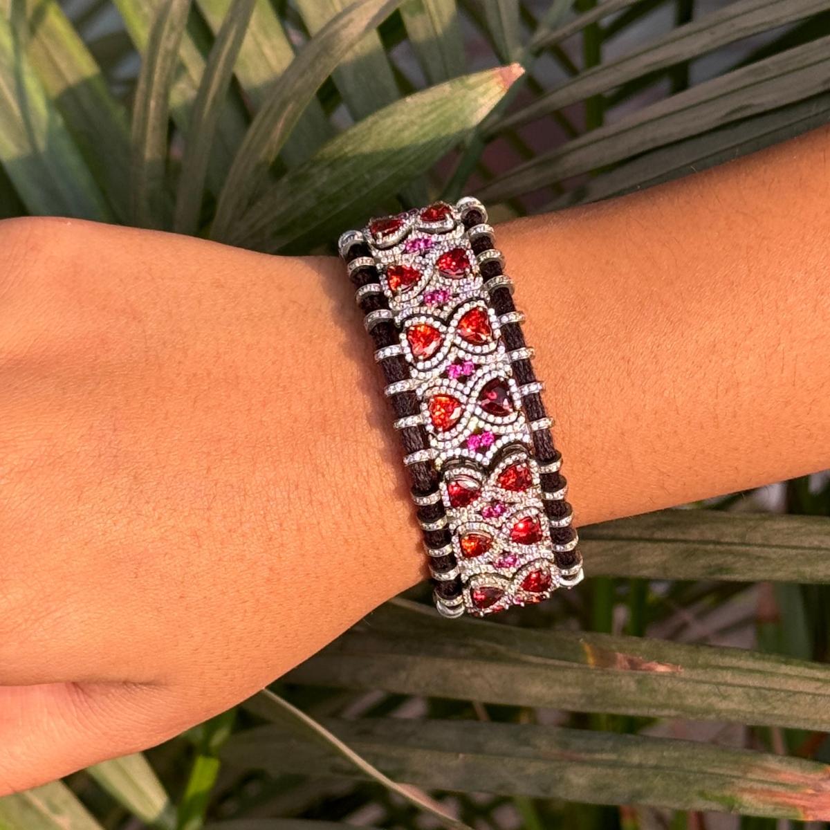 Pave Cut Red Stone Macrame Thread Bracelet in sterling silver. You shall need statement thread bracelet to make a statement with your look. Each piece features dazzling cubic zirconia stones, renowned for their brilliance and clarity, set in