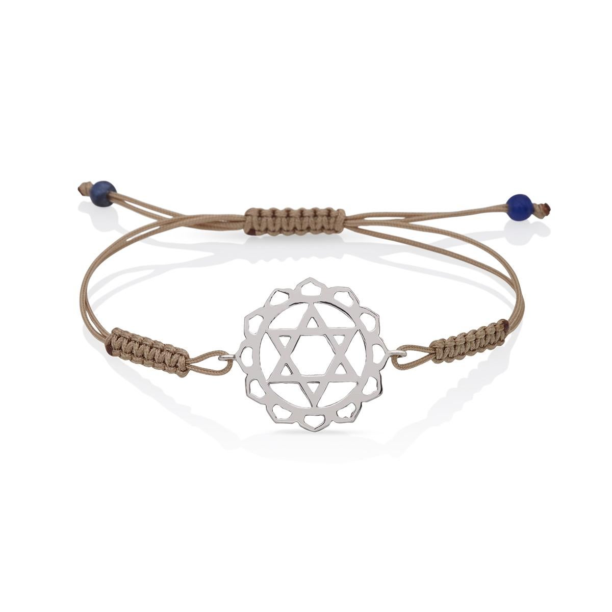 Macrame brown Cord Yoga Bracelet with the Anahata Heart Chakra in 14 Kt white Gold with Lapis Lazuli .
A very beautiful and wearable macrame bracelet made of 14Kt Gold with the Anahata Heart Chakra. It will match with everything in your closet.