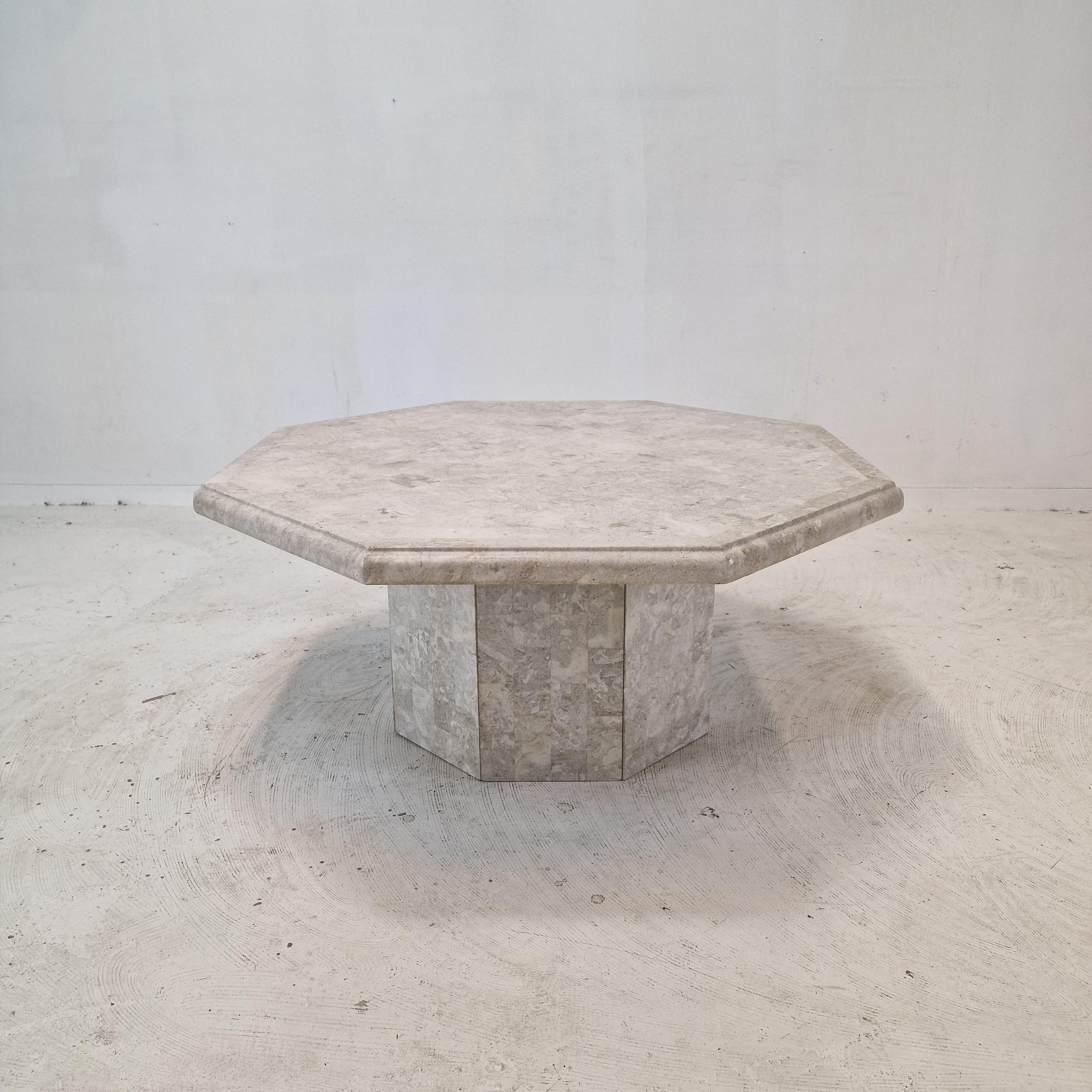 Very nice and rare coffee or side table, fabricated in Belgium in the 80's.

This stunning table is made of polished edged Mactan stone or Fossil stone.
The weight is around 25 kg (90 lbs).

Please take notice of the very nice patterns. 

It has the