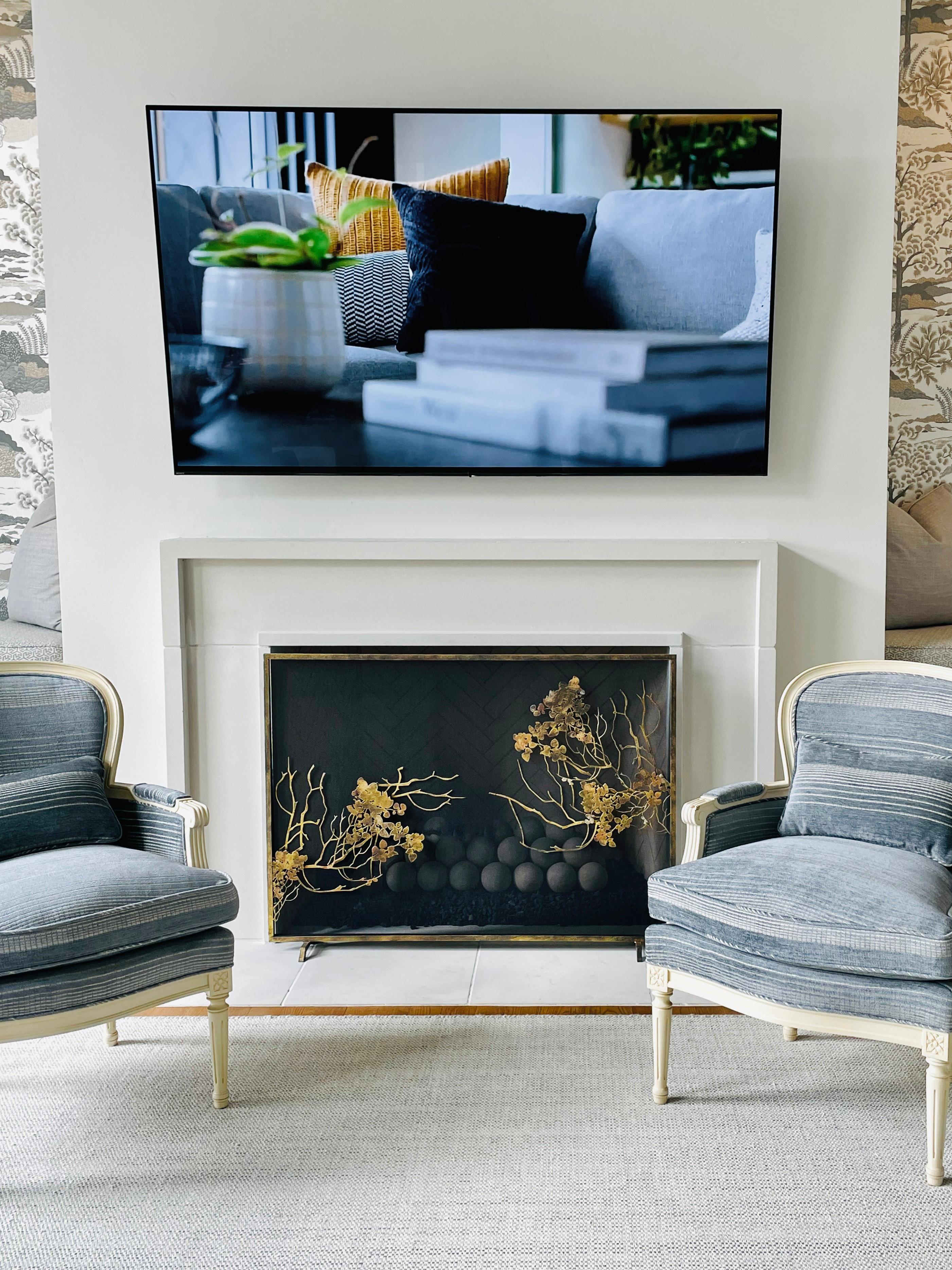 The Madalyn fireplace screen lends a soft natural touch to the fireplace, with individual layers of branches and leaves. Handmade of plasma-cut and forged iron, each component is artfully placed by an American metal artisan to create a one-of-a-kind