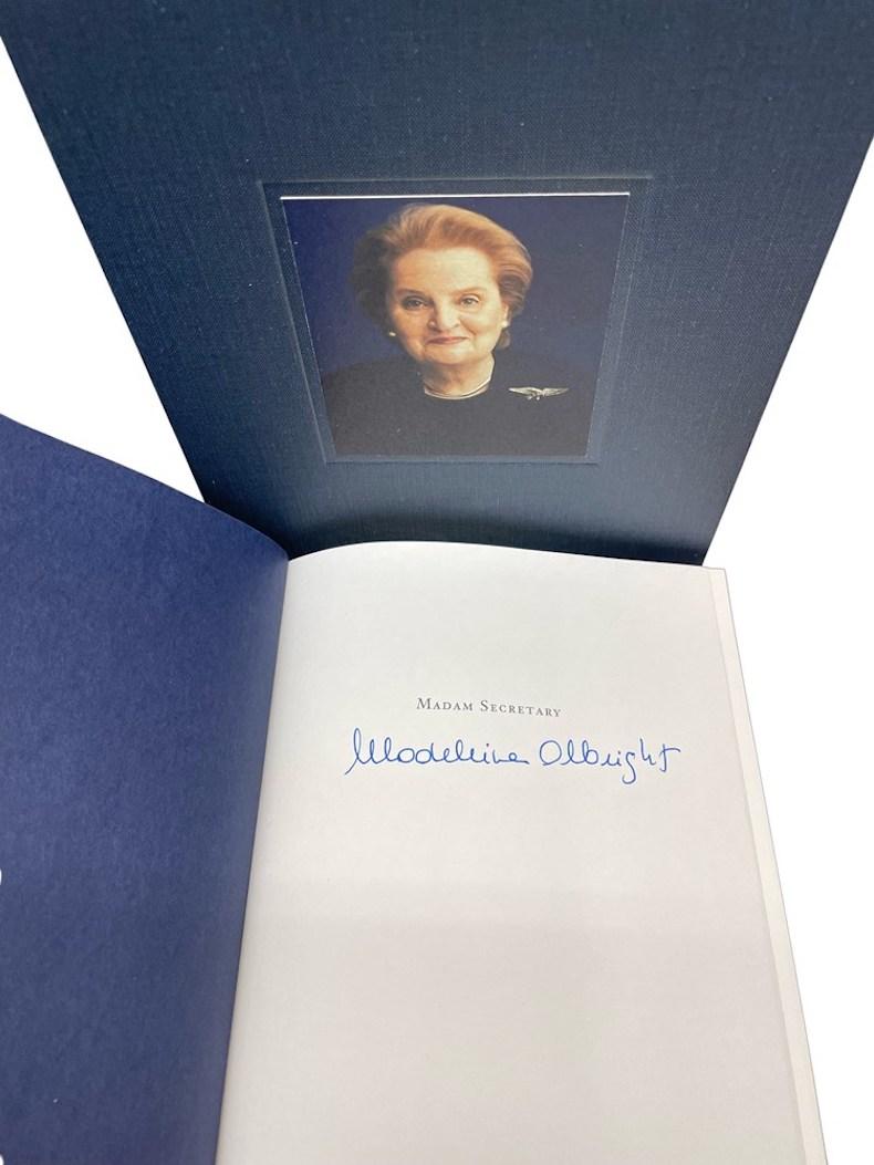 Albright, Madeleine. Madam Secretary. New York: Miramax Books, 2003. First Edition. Signed. Octavo. Publisher’s original black cloth spine over gray boards and original pictorial dust jacket. New archival cloth slipcase. 

Presented is a signed,