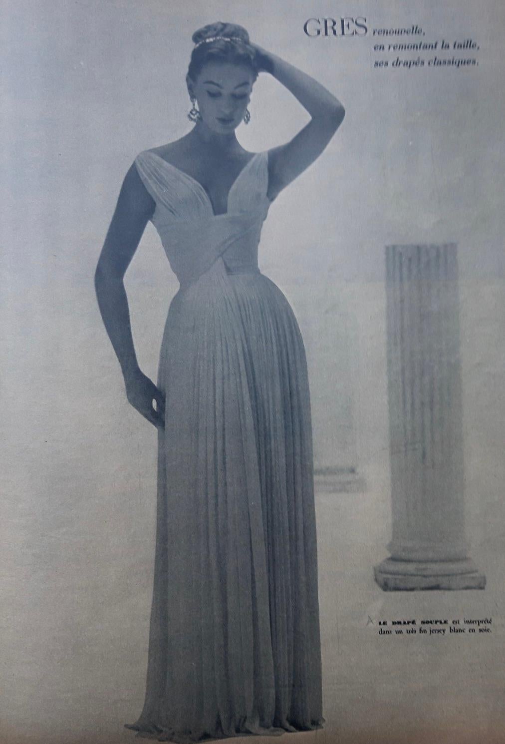A true relic of 20th-century fashion history, this original Madame Grès Haute Couture gown from 1956 embodies the sculptural elegance and technical mastery that define her legacy. Crafted in a vivid chartreuse yellow silk jersey, the gown features
