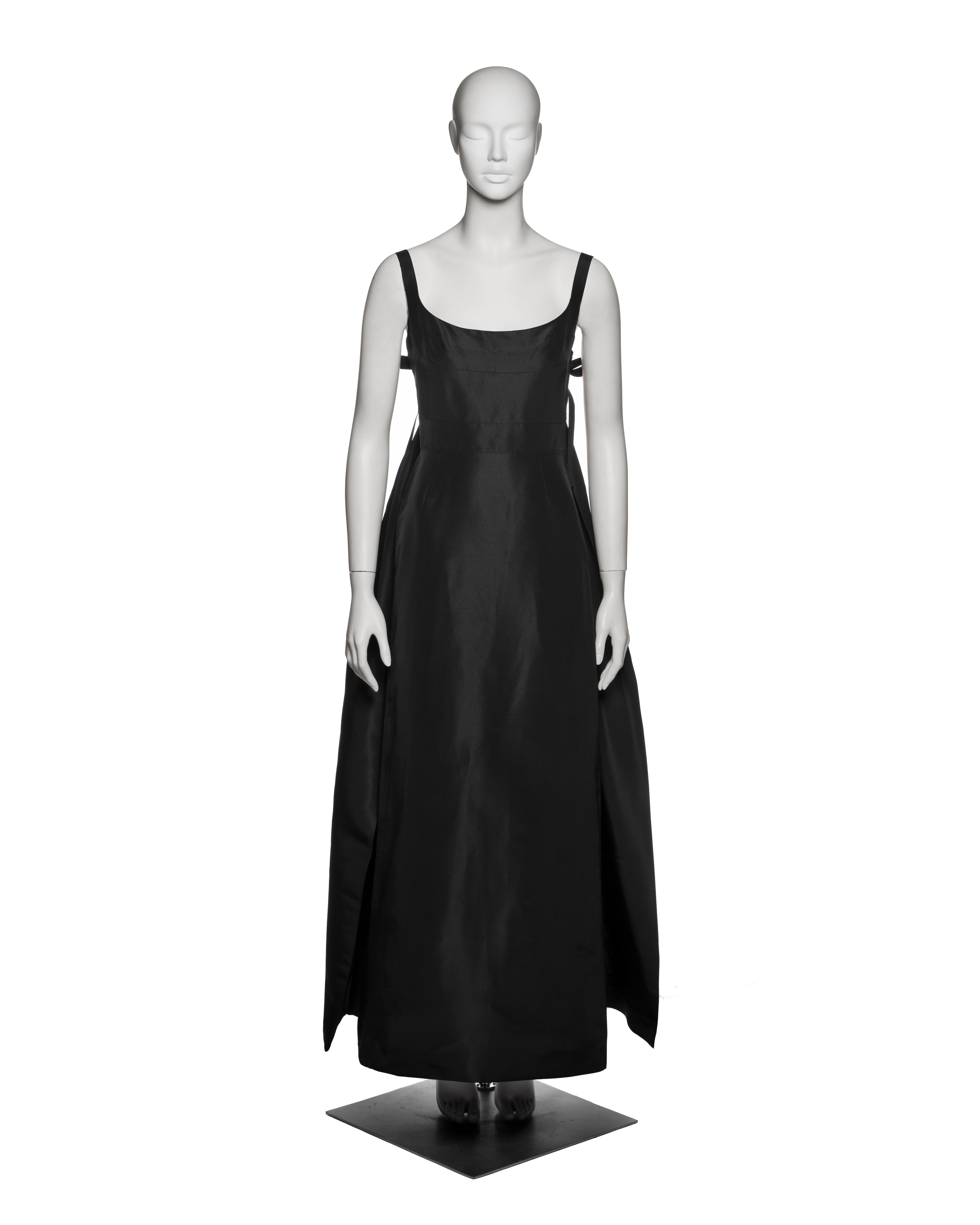 Haute Couture black silk faille evening dress by Madame Grès, circa 1965. The design features a square neckline with narrow shoulder straps and a high-waisted, sculpted bodice composed of multiple shaped panels that contour the bust. A distinctive