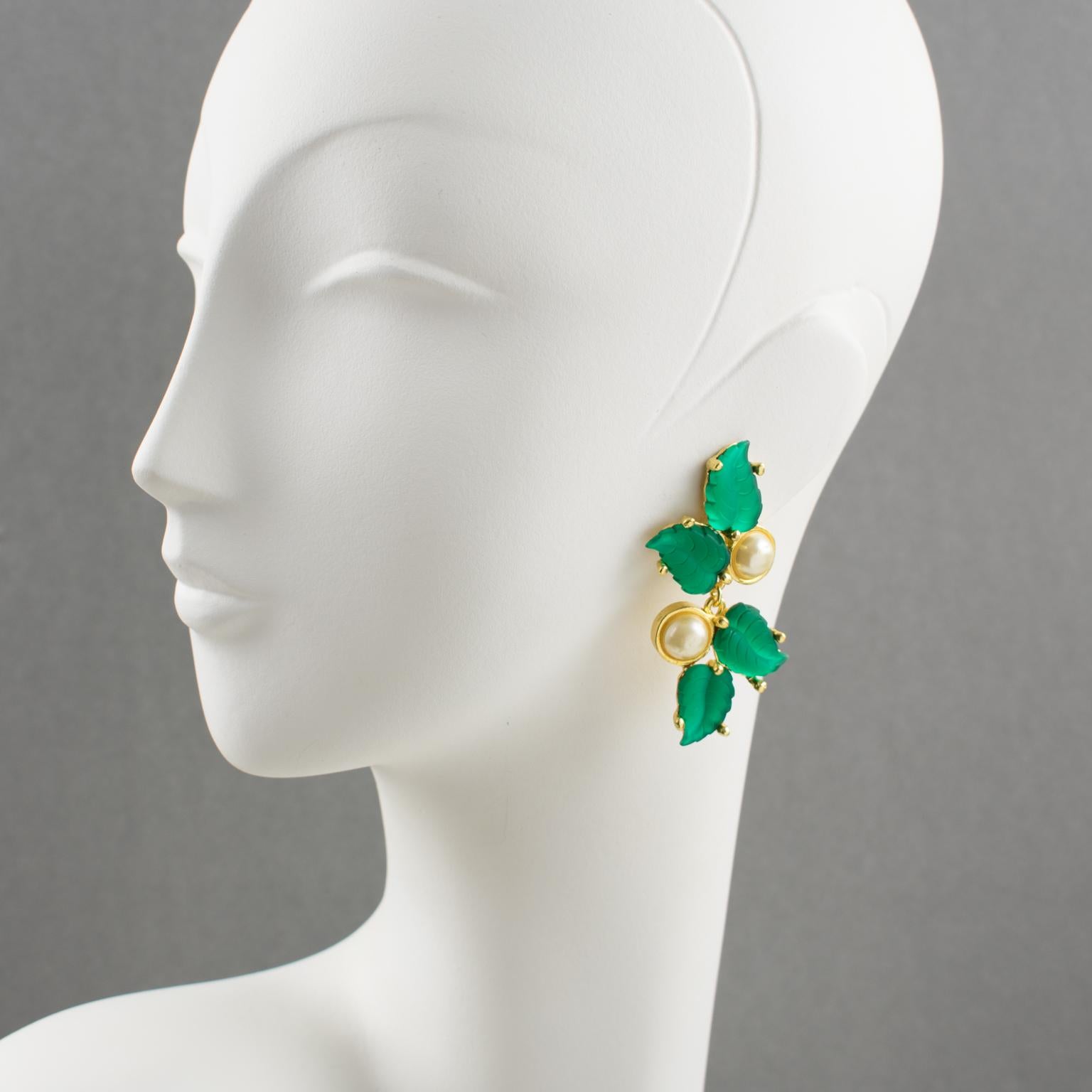 Very chic Madame Gres Paris clip-on earrings. Romantic floral design with dangling shape featuring emerald green poured glass paste leaves compliment with pearl-like half beads. The earrings are signed underside on each element: 