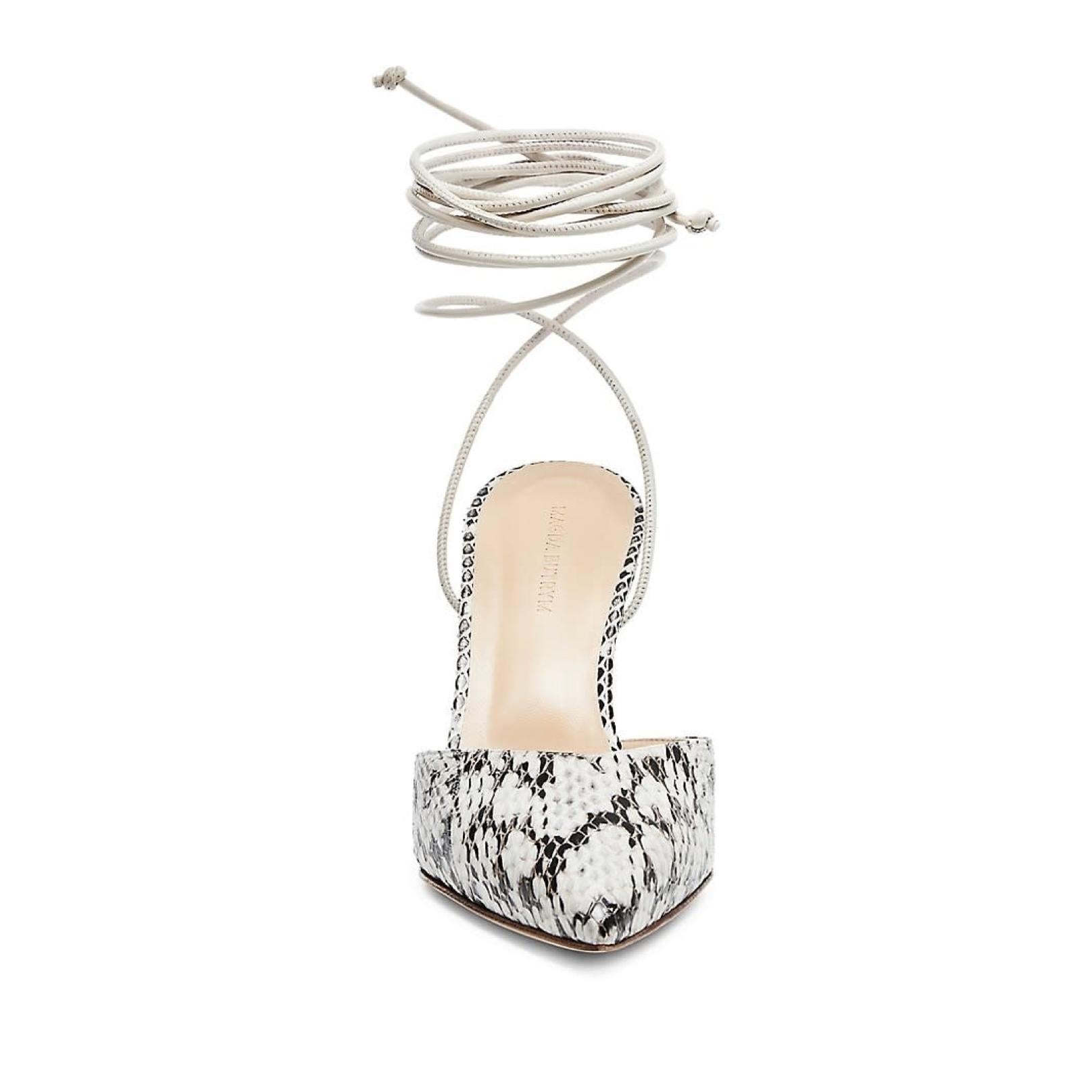 Neat and nice sandals with heels, from Magda Butrym. Pointy toe and a strap to tie around the ankle.

COLOR: Black and white
MATERIAL: Uppers, snake leather. Sole, calf leather.
SIZE: 38 EU / 7 US
HEEL HEIGHT: 100 mm / 4”
CONDITION: New.
COMES WITH: