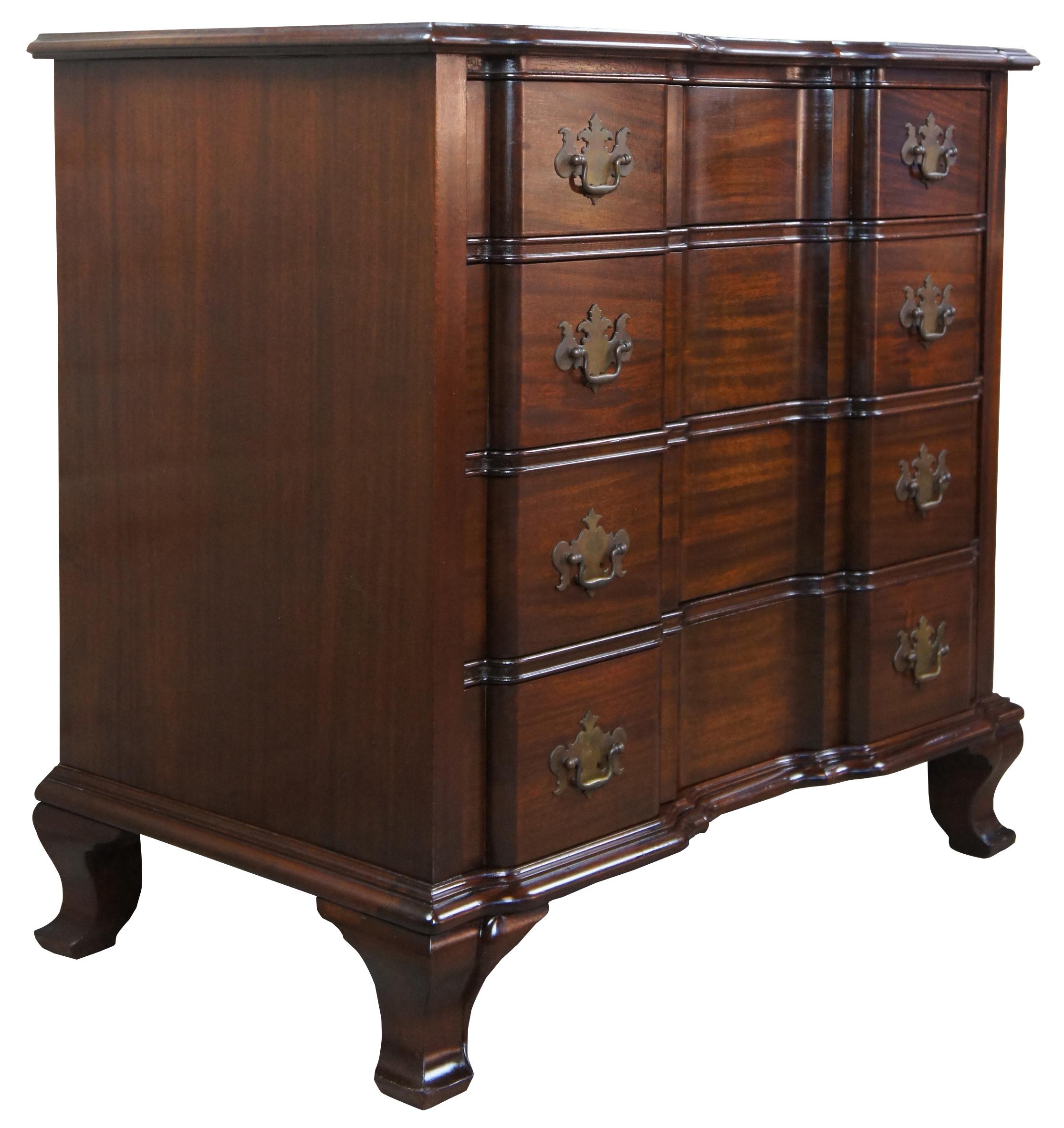 Maddox reproduction block front chest, circa 1970s. Made from solid mahogany with four dovetailed drawers and brass hardware.
  