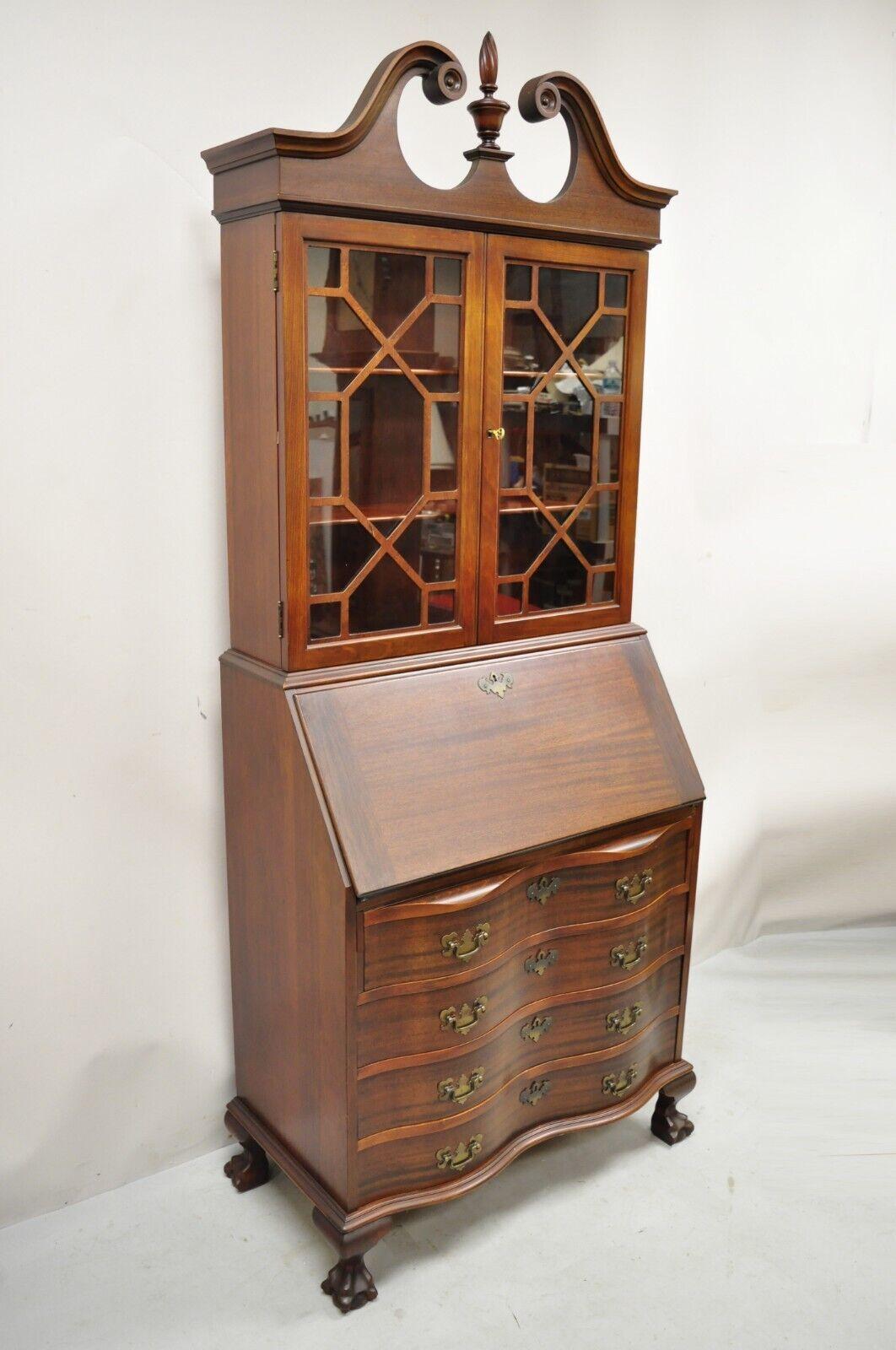 Maddox Mahogany chippendale style ball and claw secretary desk bookcase. Item features fitted interior, beautiful wood grain, original label, working lock and key, 4 dovetailed drawers, 2 wooden shelves, carved ball and claw feet, solid brass