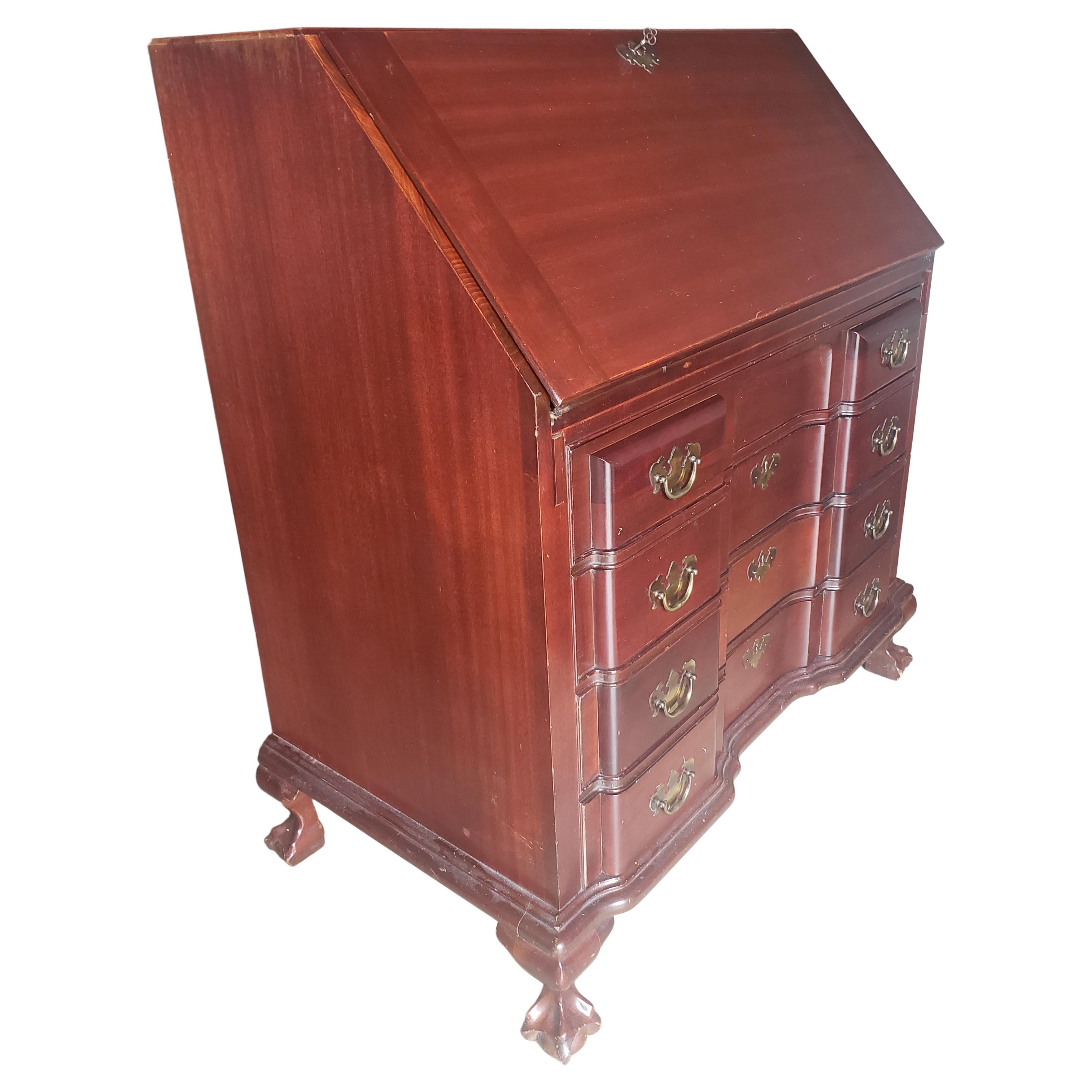 A refinished Maddox Red Mahogany Chippendale Block front,  Slant Front Secratary Desk with Key. Desk door locks, along with the three lower drawers. All drawers work as originally intended and are all dovetail joints constructed. Very clean vintage
