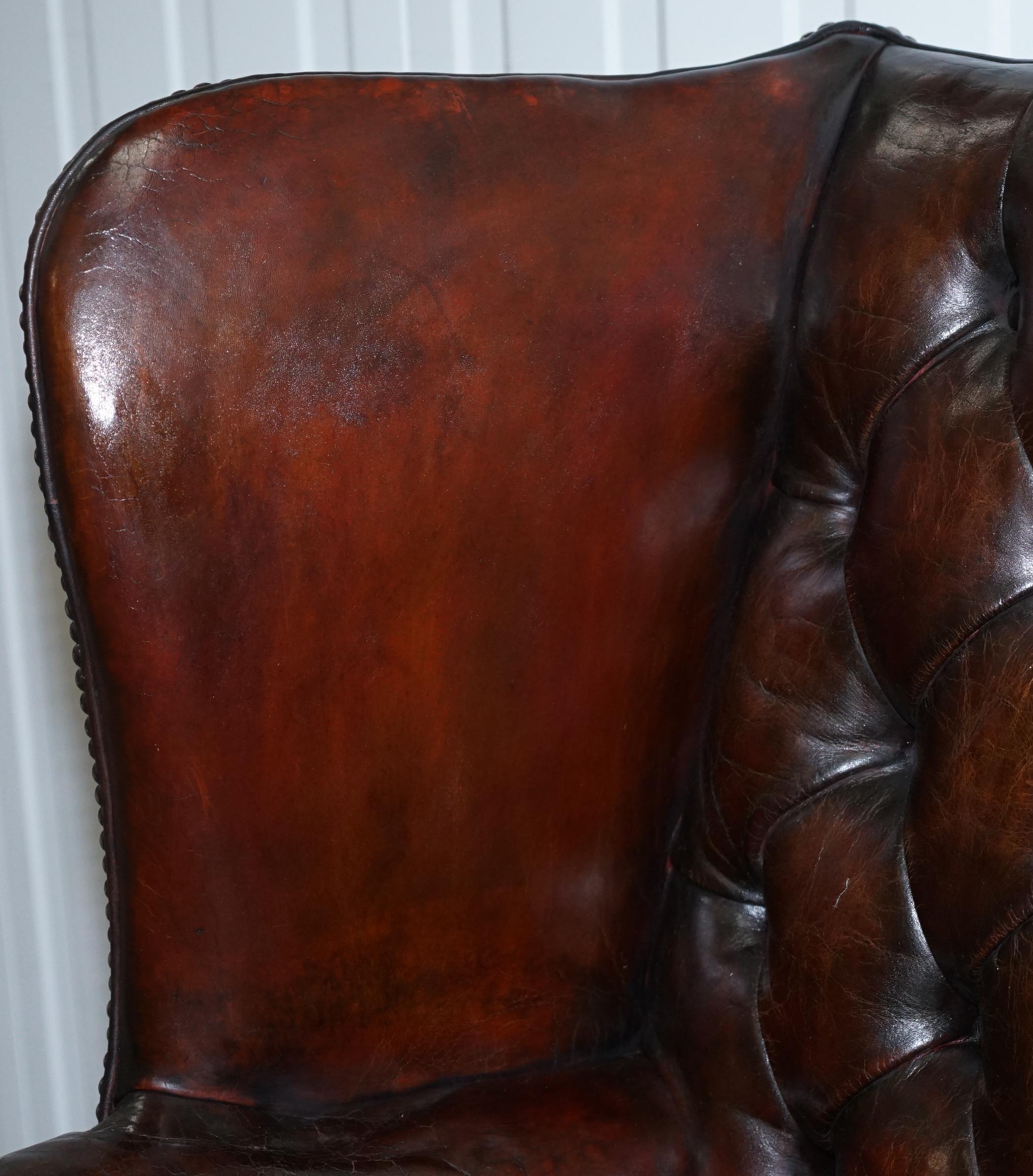 Mid-20th Century Made in England Chesterfield Leather Wingback Claw & Ball Armchair and Footstool