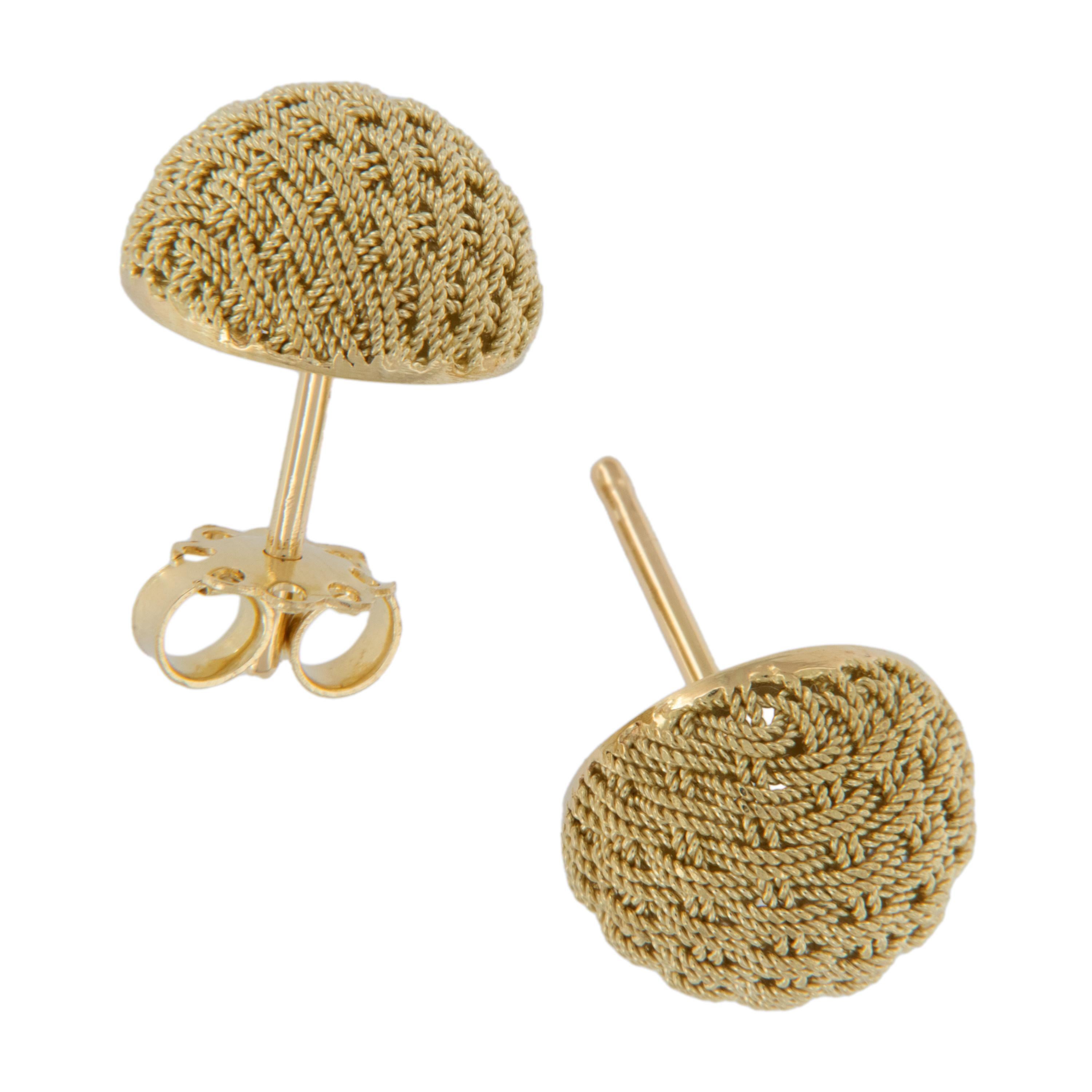 Italian craftsmen are known for their intricate finishes which are apparent on these adorable twisted wire basket weave button earrings. Made from rich 18 karat yellow gold these earrings are 12.54mm in diameter with posts and friction backs for