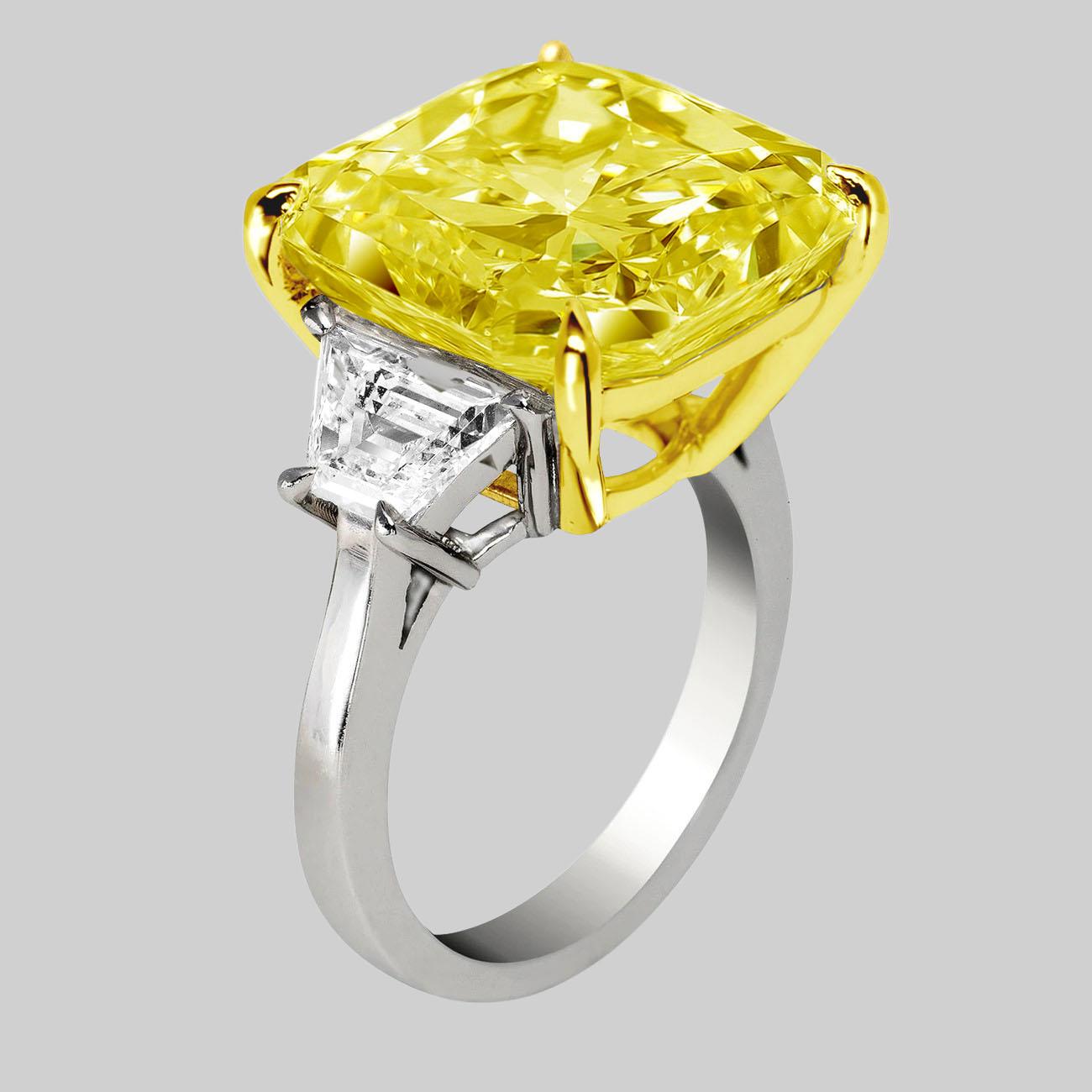 Antinori di Sanpietro fancy yellow color Cushion Cut Engagement Ring and this ring is perfection with a 6 carat Fancy Yellow Cushion Cut Diamond of VVS2 clarity, GIA Certified, with 1 carat in F Color side trapezoid cut diamonds in Platinum and 18