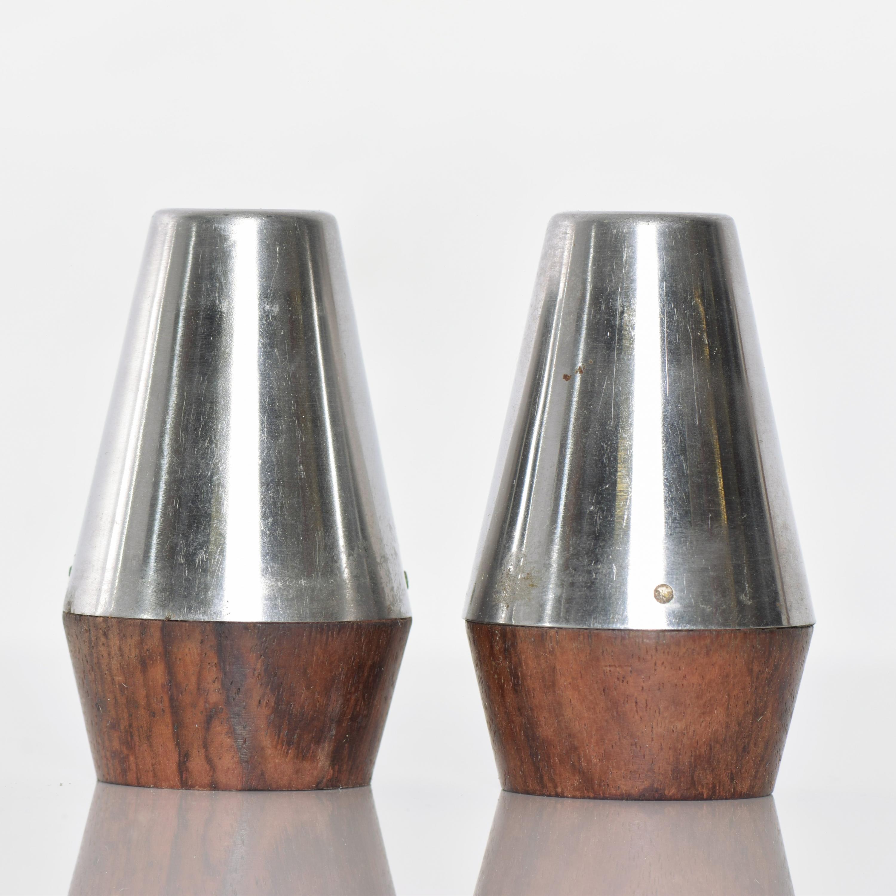 Midcentury Modern design Modern Stainless Steel & Rosewood Salt & Pepper Shaker Set 1960s. 
Made in Japan 
In the style of A & B Lundtofte of Denmark and Dansk Designs.
Measures: 2.75