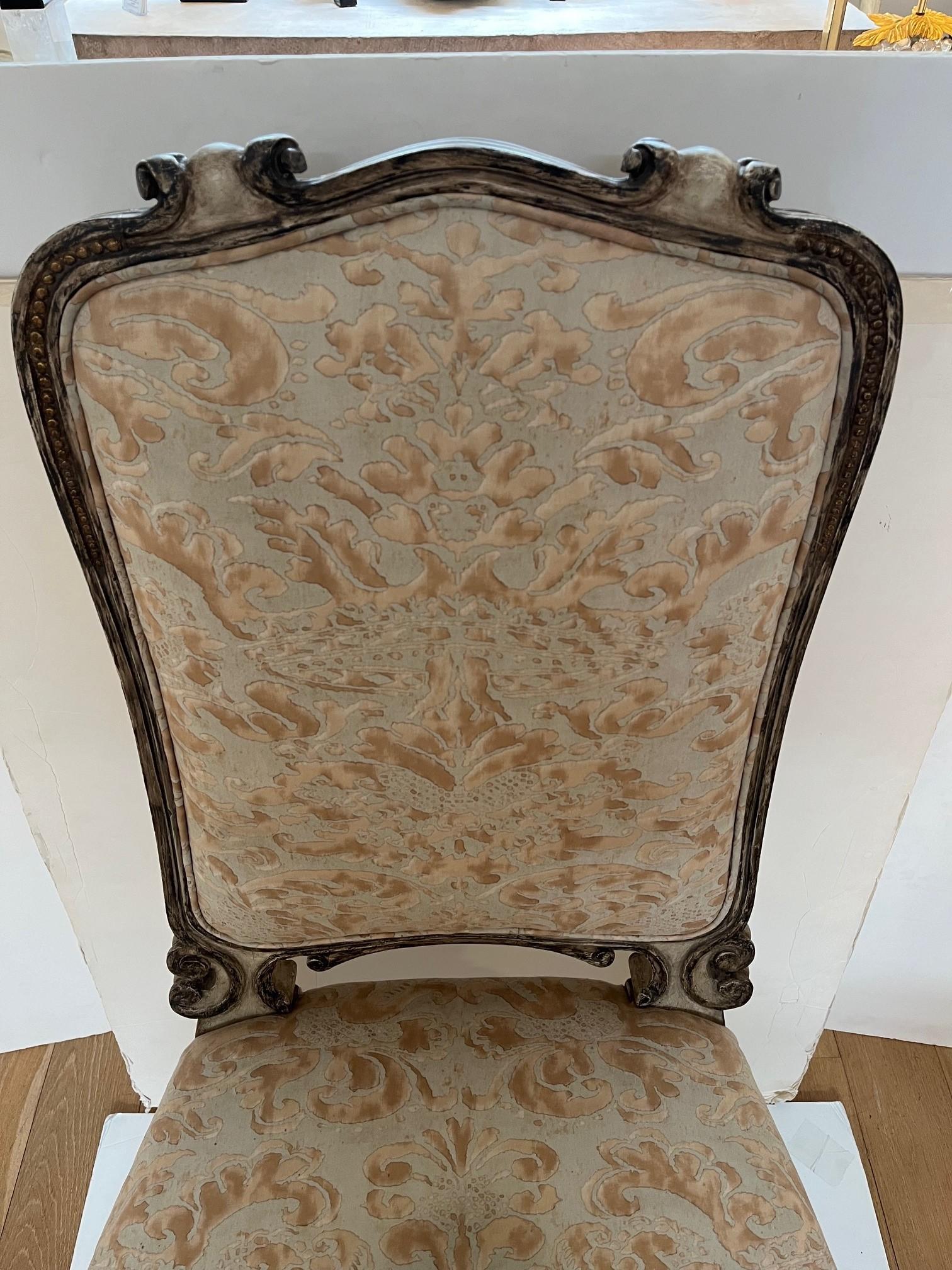 Made to Order Carved Back and Legs Fontain Dining Side Chair, Finish Hand Painted and Gold Leaf Accents and Upholstered in Fortuny Fabric, This a Showroom Model
Upholstery: Customer Own Material