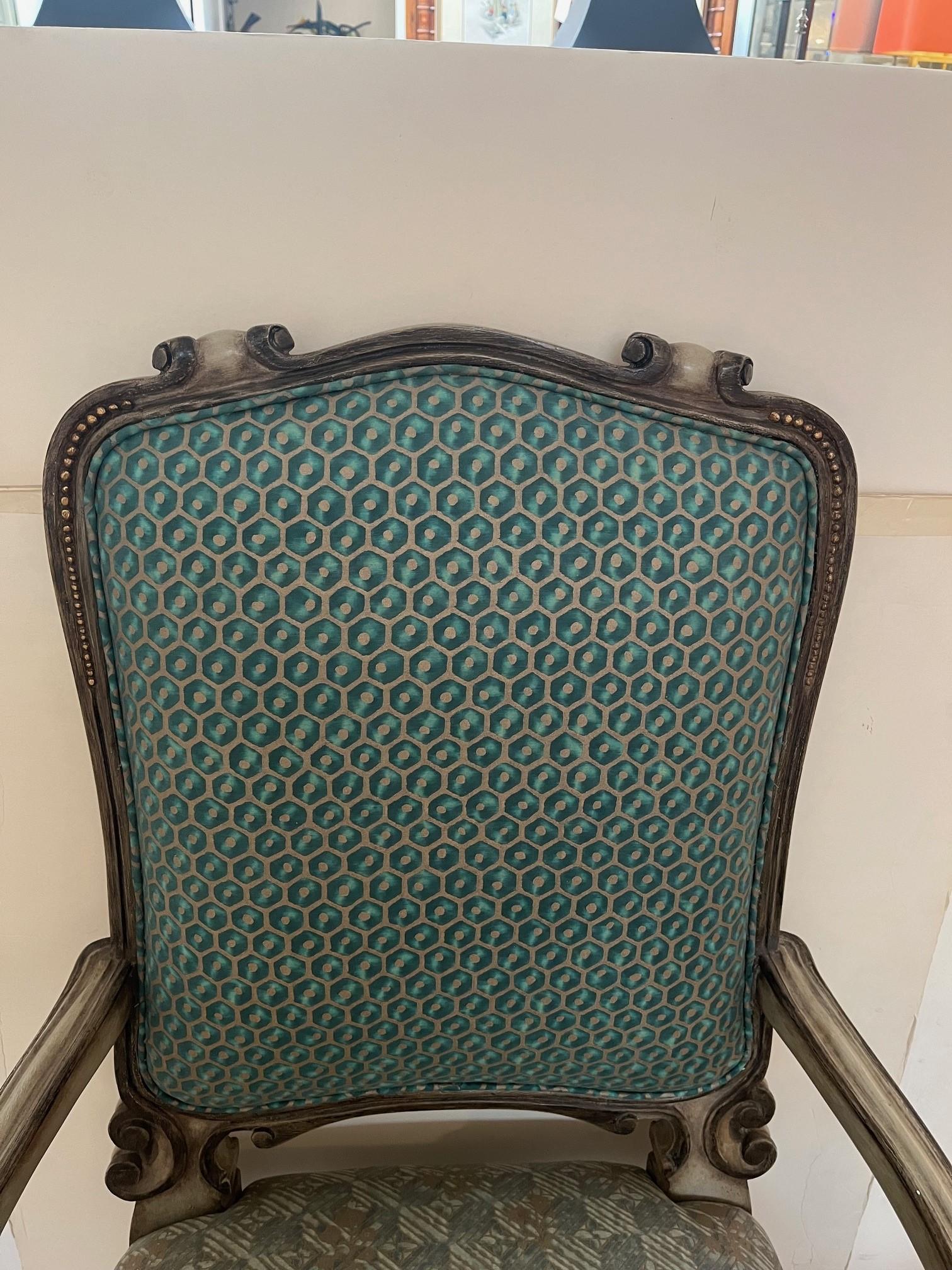 Made to Order Hand Carved Hand Painted Fontain Dining Armchair Finish with Antique Painted Finish with Gilded Detail, upholstered in Fortuny Fabric, this is a Showroom Model
upholstery: Customer Own Material