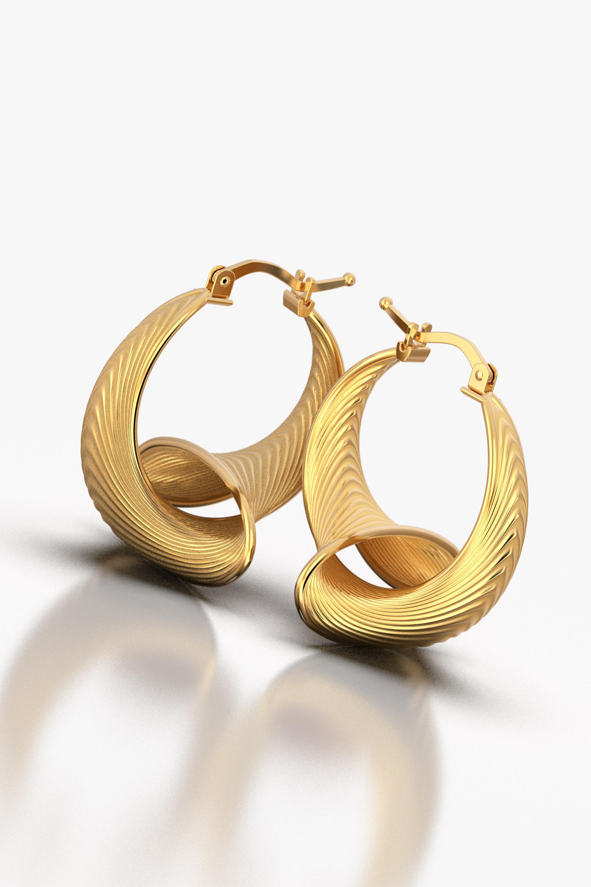 Elevate your style with our 24 mm Diameter Hoop Earrings in 18k Gold, a harmonious blend of Italian craftsmanship and modern innovation. These captivating earrings boast a striking fusion of classic beauty and futuristic design, handcrafted in