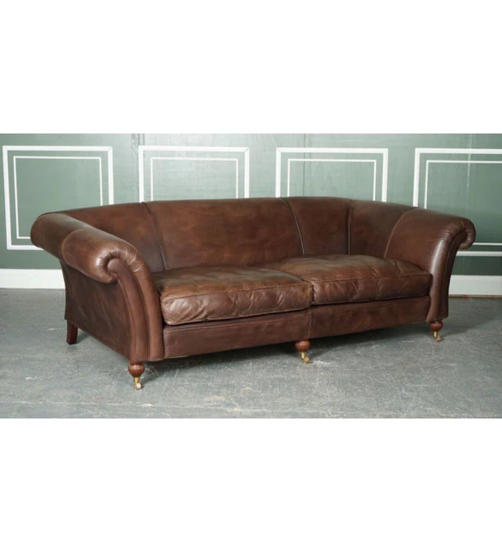 We are delighted to offer for sale this lovely made-to-order large heritage brown leather three to four-seater sofa.

This sofa has been handmade by Mark Elliot, a manufacturer based in Suffolk, England. This company has been making custom-made