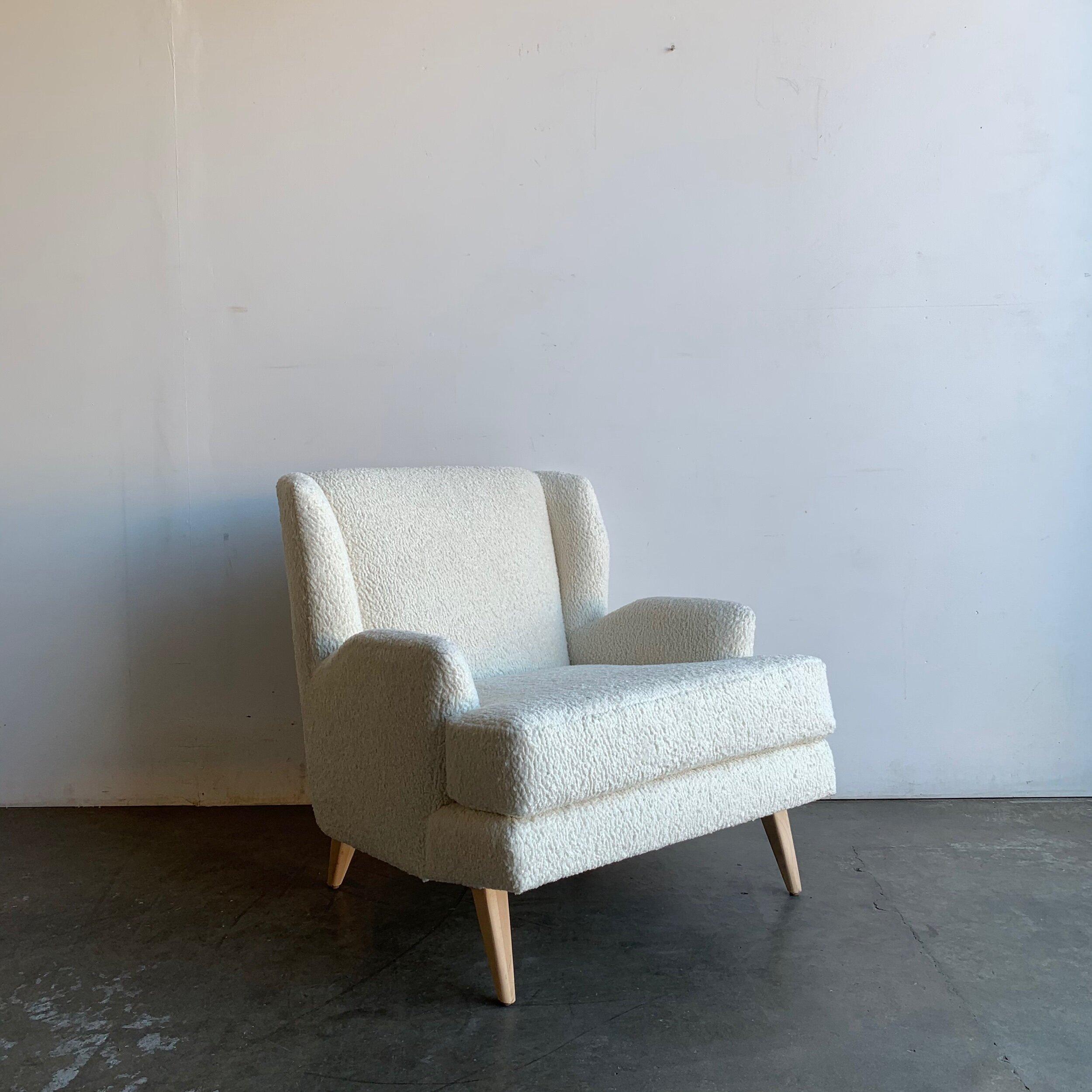 Handcrafted wingback chair in white Sherpa fabric. This can be made in any fabric. This item is not currently available on the showroom floor but can be made available within 4-6 weeks after purchase in your choice of fabric, dimensions and