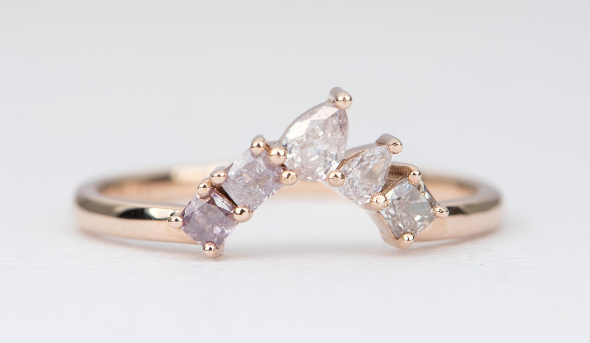 ♥ This is a made-to-order item and will take 6-8 weeks to complete.

♥  A 14k rose gold curve ring featuring natural pink diamonds forming a cluster and asymmetrical contour to perfectly complement your engagement ring  
♥  Each diamond is