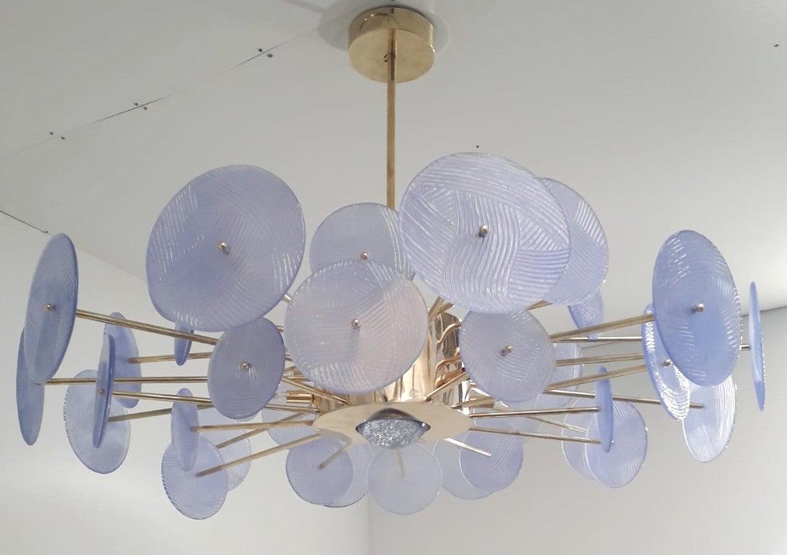 Italian chandelier with periwinkle purple Murano glass discs and polished brass finish frame by Fabio Ltd, made in Italy
12-light / G9 type / max 40W each
Measures: Diameter 41.5 inches, height 27.5 inches including rod and canopy
Order only /