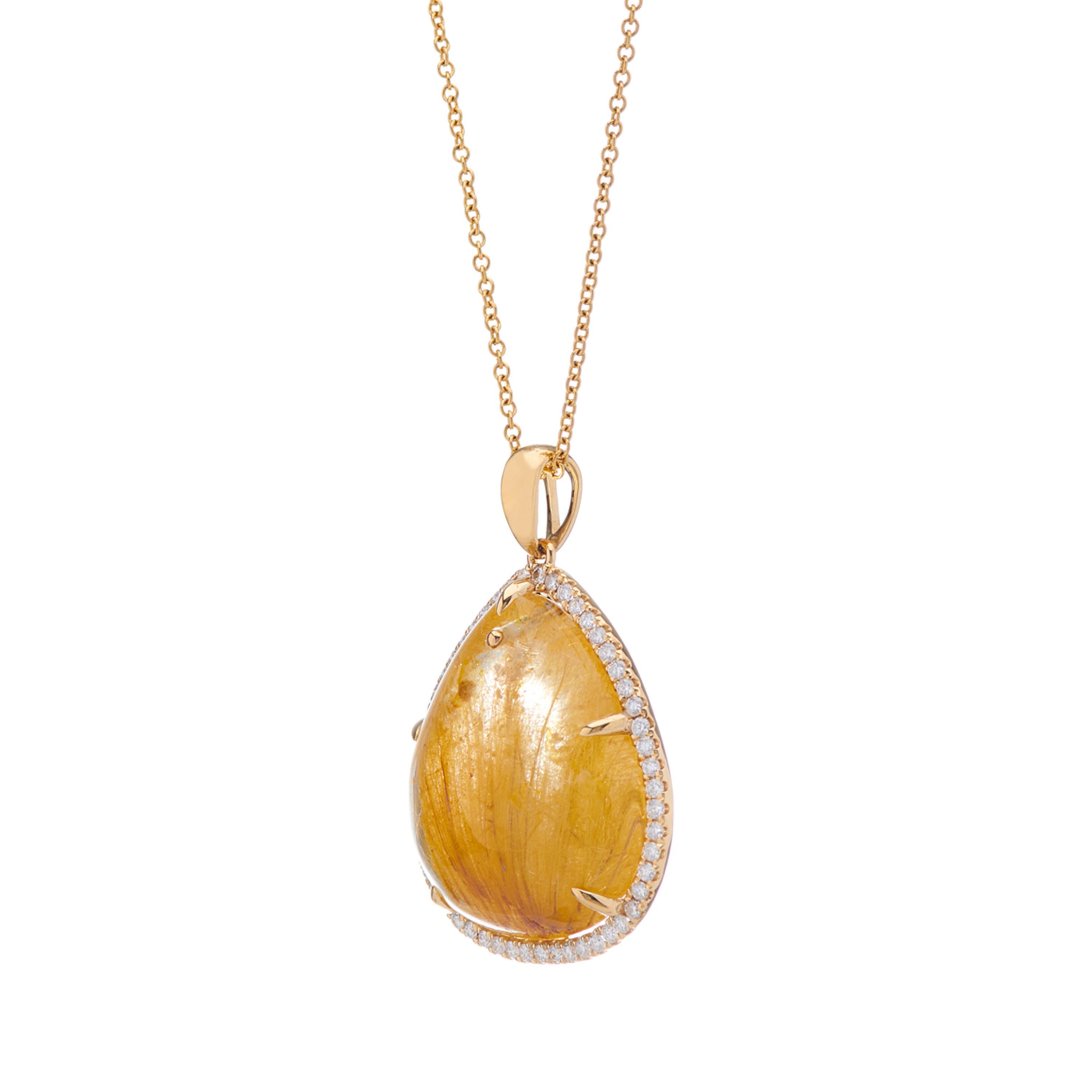 Description:
Made-to-order asymmetric ~30.6ct rutilated quartz pendant, bordered with brilliant diamonds with a combined weight of ~0.391ct and set in 18 karat yellow gold. 

