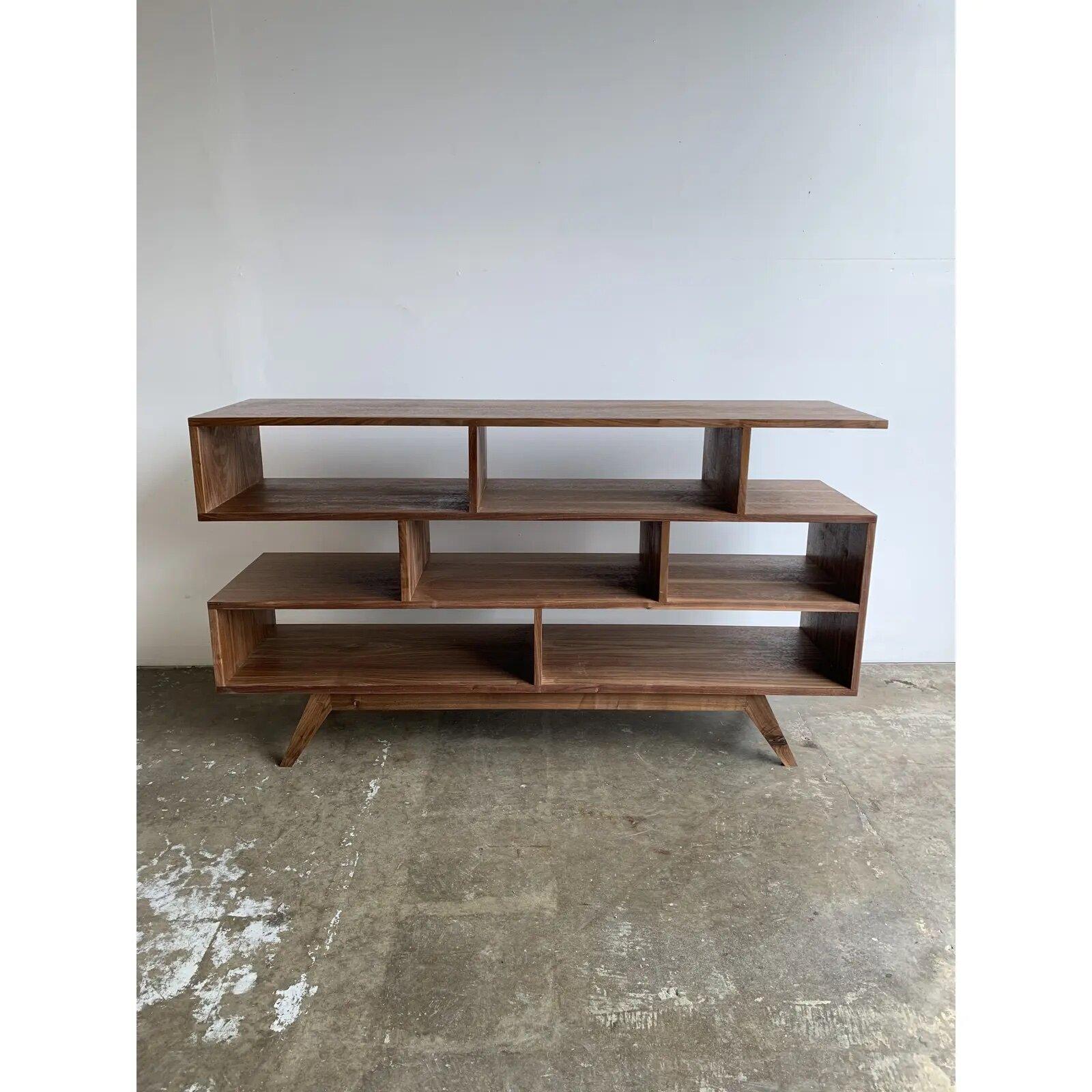 DIMENSIONS60ʺW × 16ʺD × 33.75ʺH

Sharp and clean lines define this bookcase all in a gorgeous natural walnut tone. Handcrafted with completely customizable dimensions.
This item is not currently available on the showroom floor but can be made