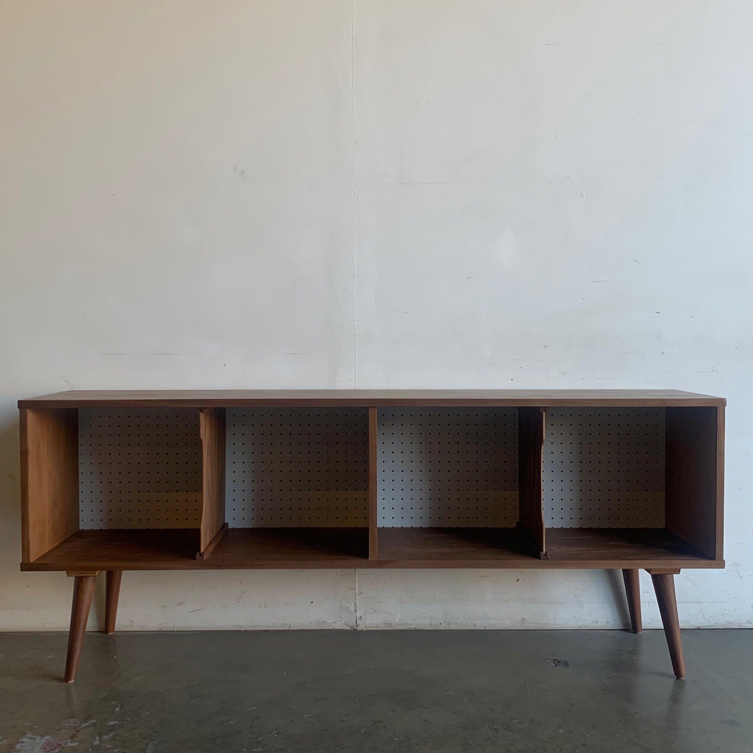 W64 D13.25 H25.75

This piece is custom made in house, item features removable center dividers and a white perforated backing.

This item is not currently available on the showroom floor but can be made available within 4-6 weeks after purchase in