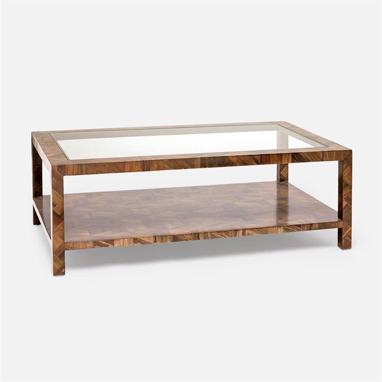 Listed is a stunning, made goods coffee table. The piece is finished with natural banana bark in a geometric design and lacquered. Photo 6 and 7 are for color reference. The tabletop has a glass insert, measuring: 24.5