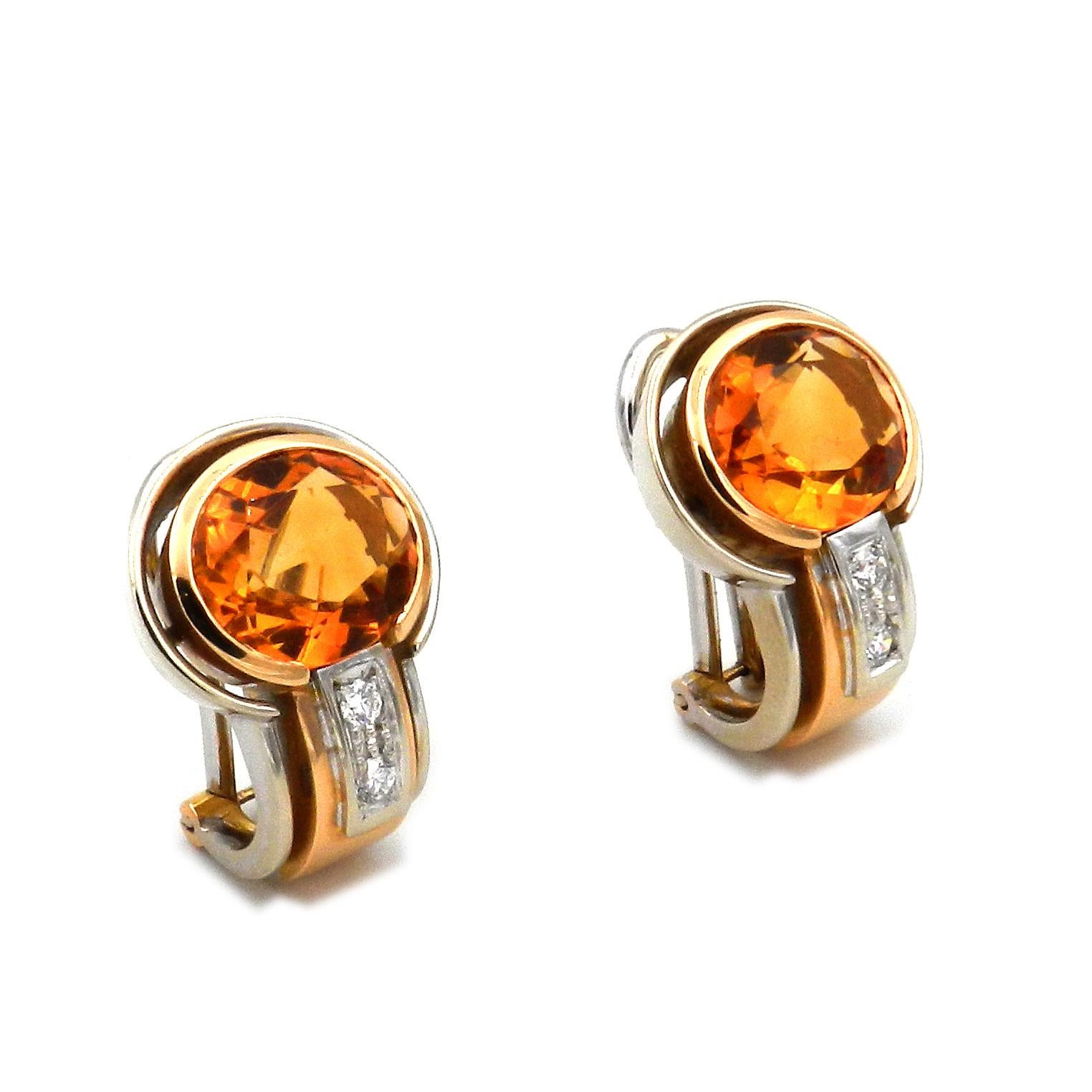 Madeira Citrine Diamond 18 K Two Tone Gold Earrings, Antonini Italy 

Sporty elegant estate earrings in yellow and white gold, studded with a magnificent oval Madeira citrine of intense color and accentuated with two radiant diamonds each. Completed