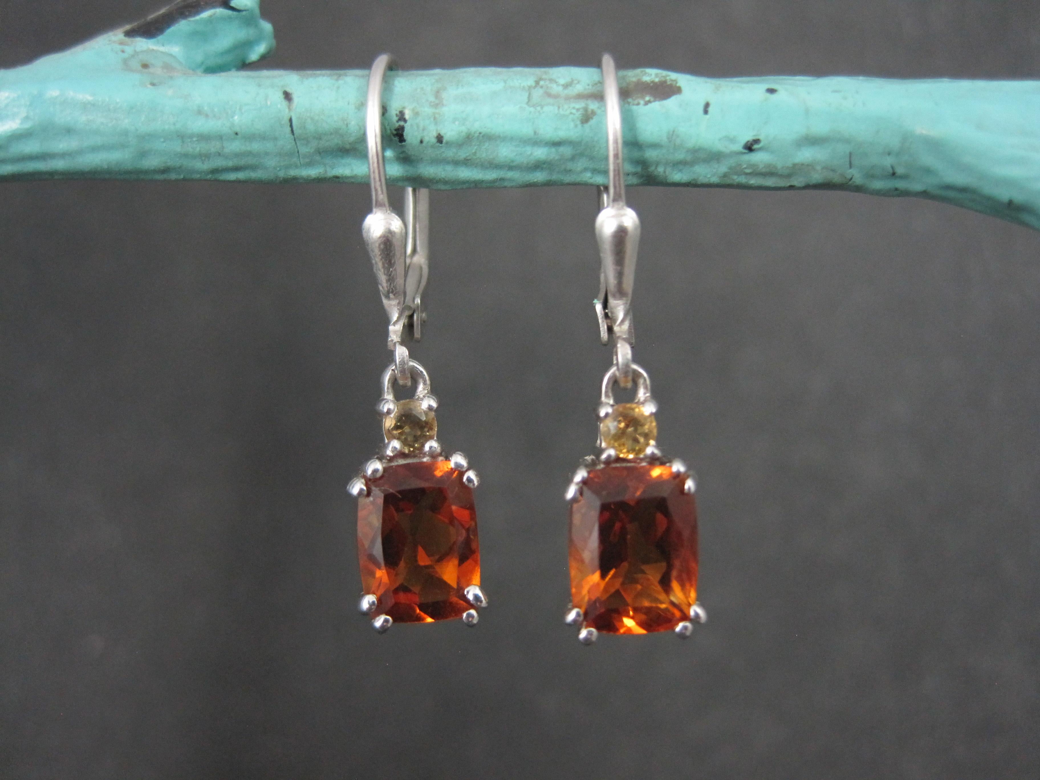 These gorgeous earrings are sterling silver with lever back closures.
Each features a 3mm citrine and an 8x6mm Maderia citrine.

Measurements: 1/4 by 1 1/8 inches from the top of the earwire
Weight: 2.9 grams

Condition: New