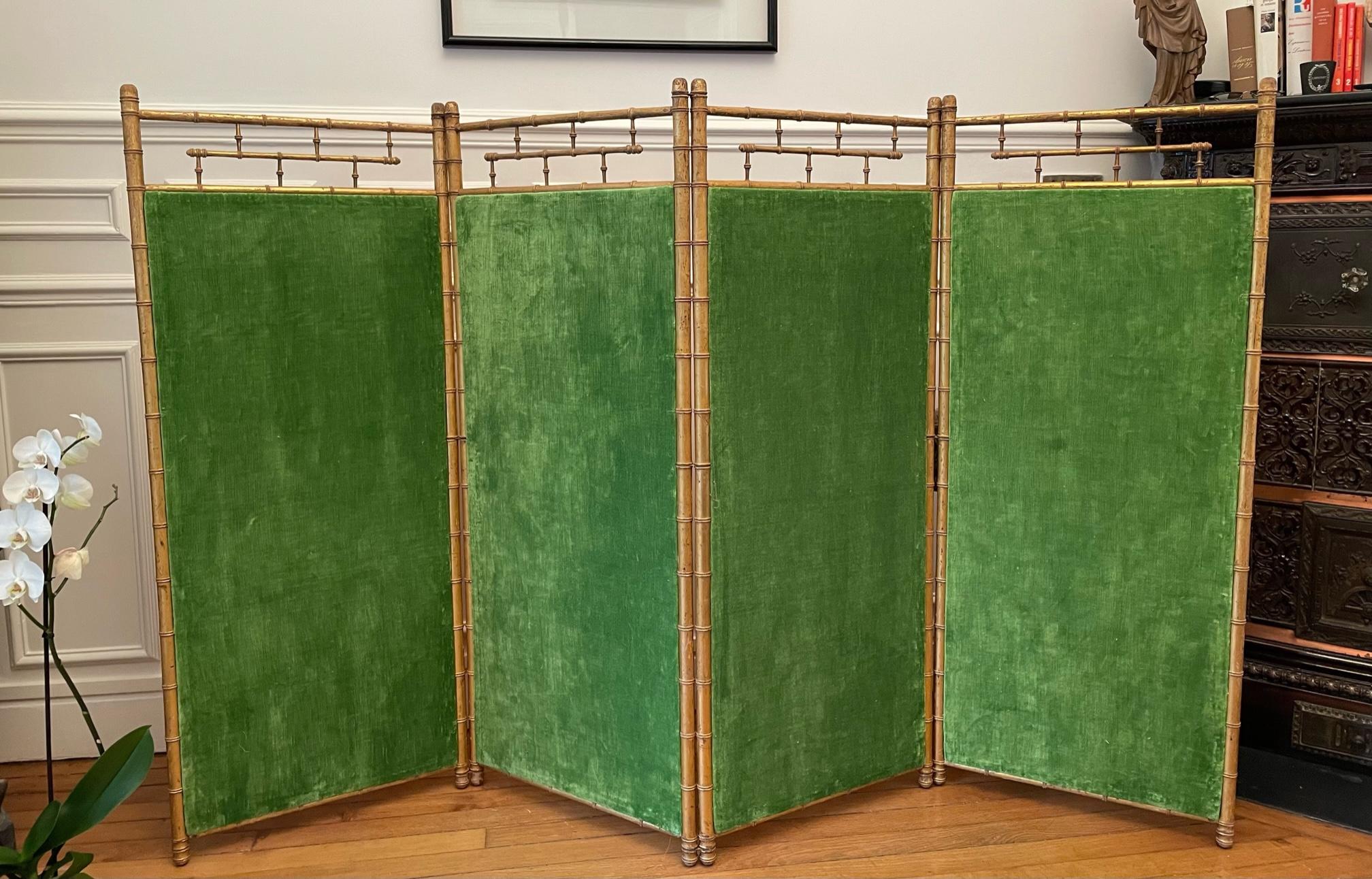 Rare Napoleon III gilded wood four-leaf screen upholstered with on the one side a Striped vintage Madeleine Castaing fabric and and on the other side a Green linen velvet remembering the decoration of the hotel particulier of Hubert de Givenchy