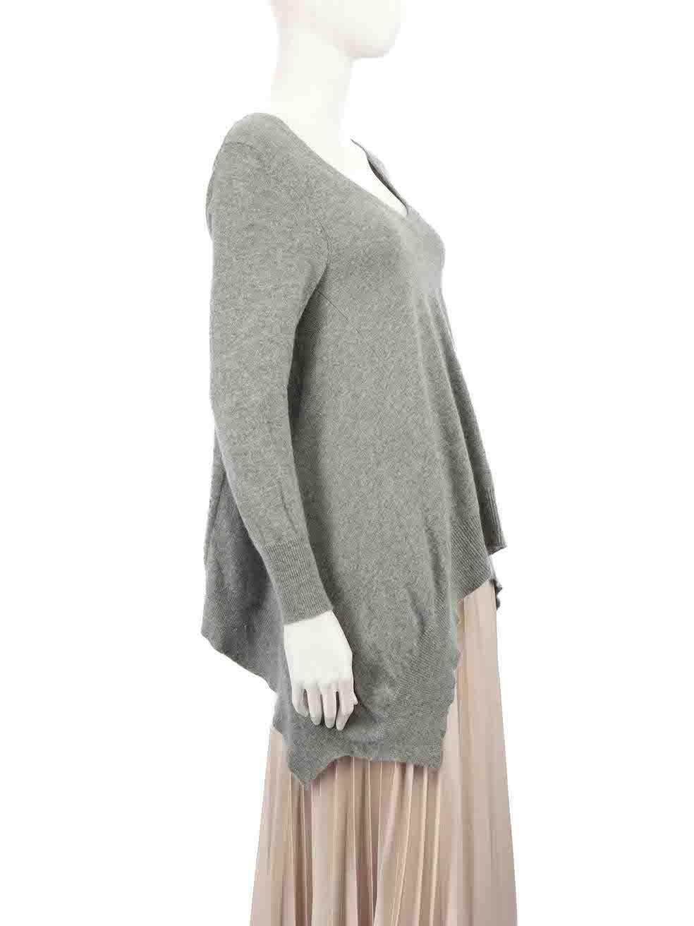 CONDITION is Very good. Hardly any visible wear to jumper is evident on this used Madeleine Thompson designer resale item.
 
 
 
 
 
 Details
 
 
 Grey
 
 Cashmere
 
 Knit top
 
 V-neck
 
 Draped hem
 
 Long sleeves
 
 
 
 
 
 Made in China
 
 
 

