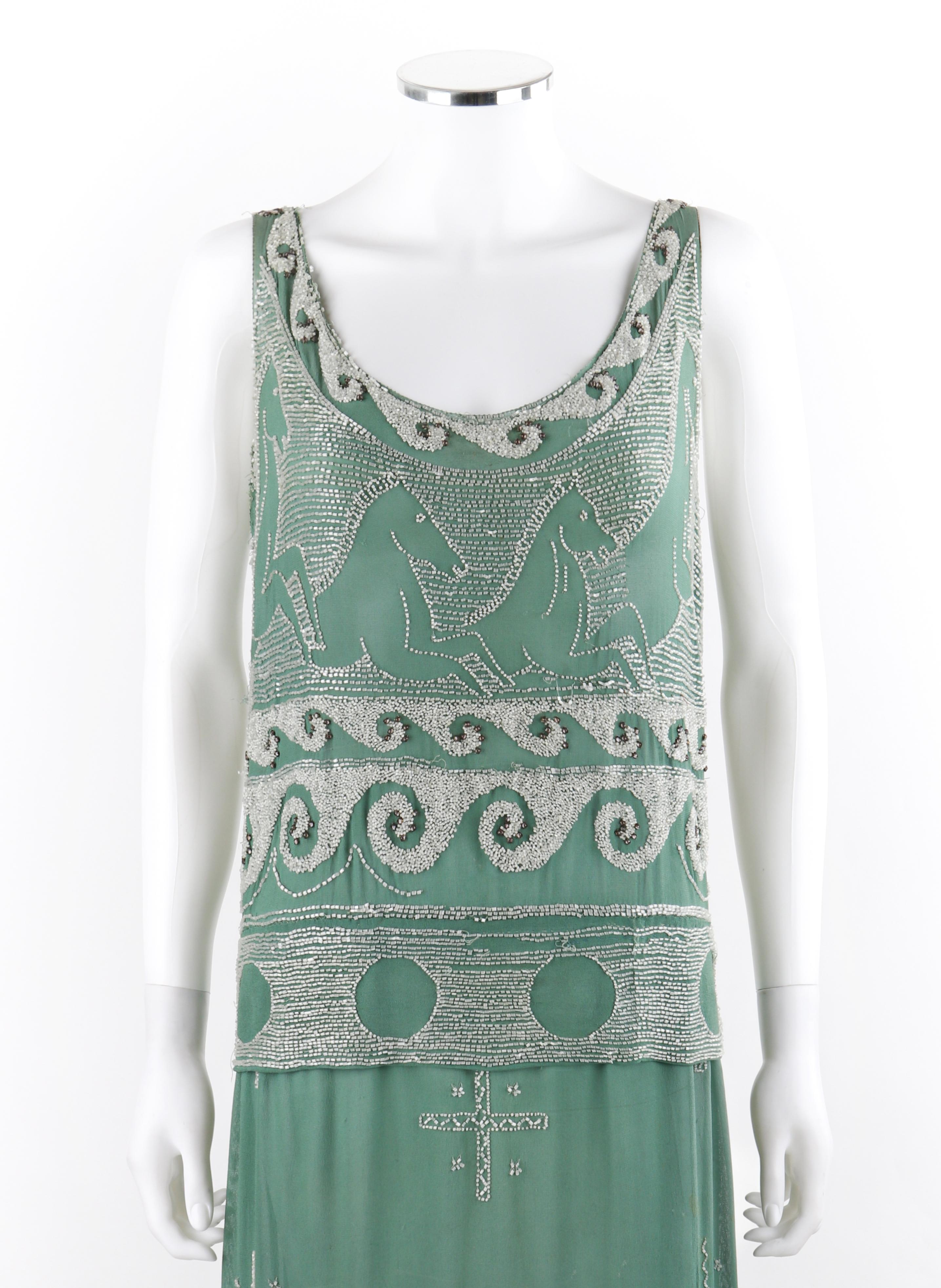 MADELEINE VIONNET c.1924 “Little Horses” Soft Green White Glass Beaded Flapper Dress
Circa: 1924
Designer: Madeleine Vionnet
Style: Flapper drop waist dress
Color(s): Shades of green, gray, and white 
Lined: No
Unmarked Fabric Content (feel of):