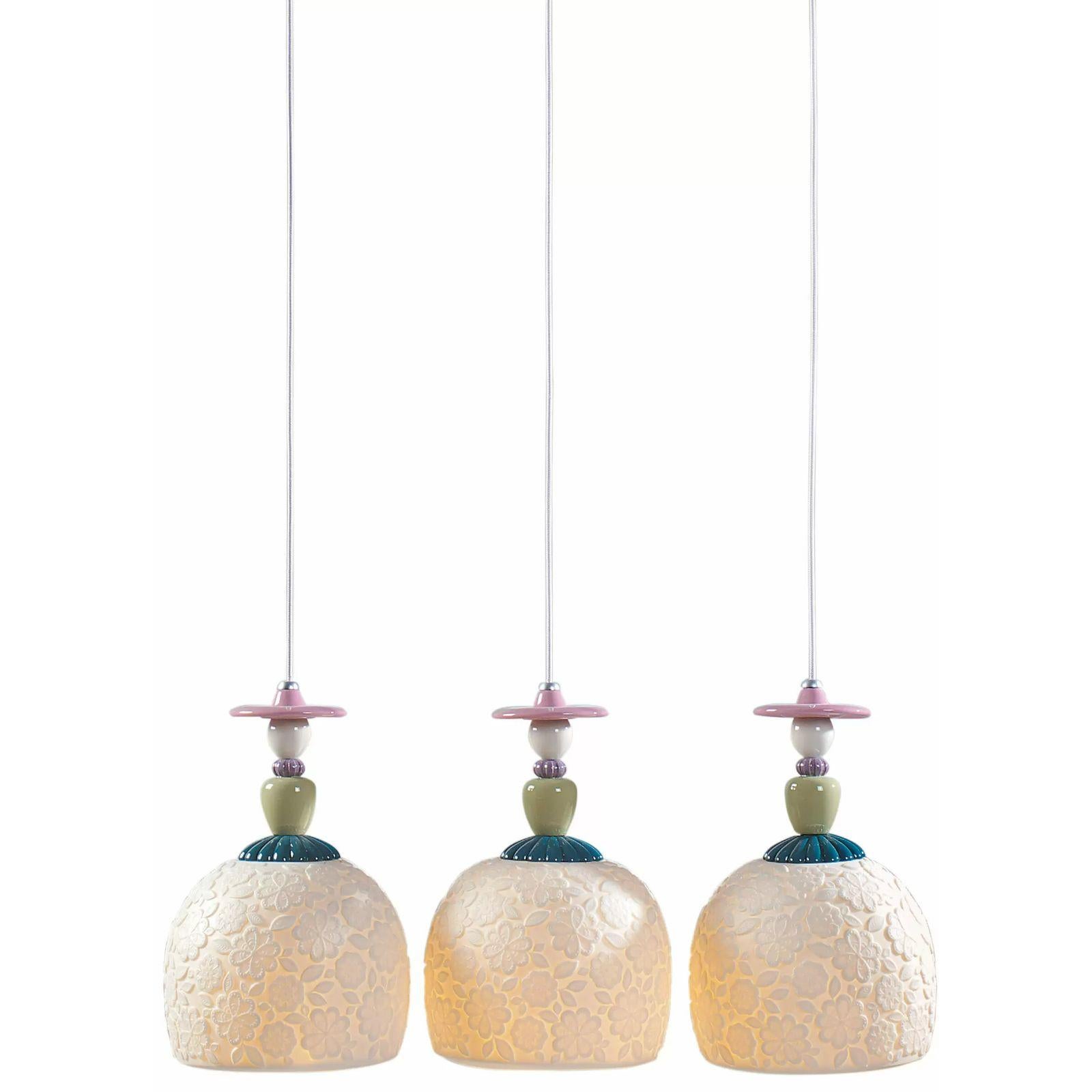 Handmade hanging ceiling lamp in brightly colored porcelain and floral decorations with three engraved translucent white porcelain tulips

The Mademoiselle collection is inspired by Lladró's romantic ladies, one of his most traditional motifs, to