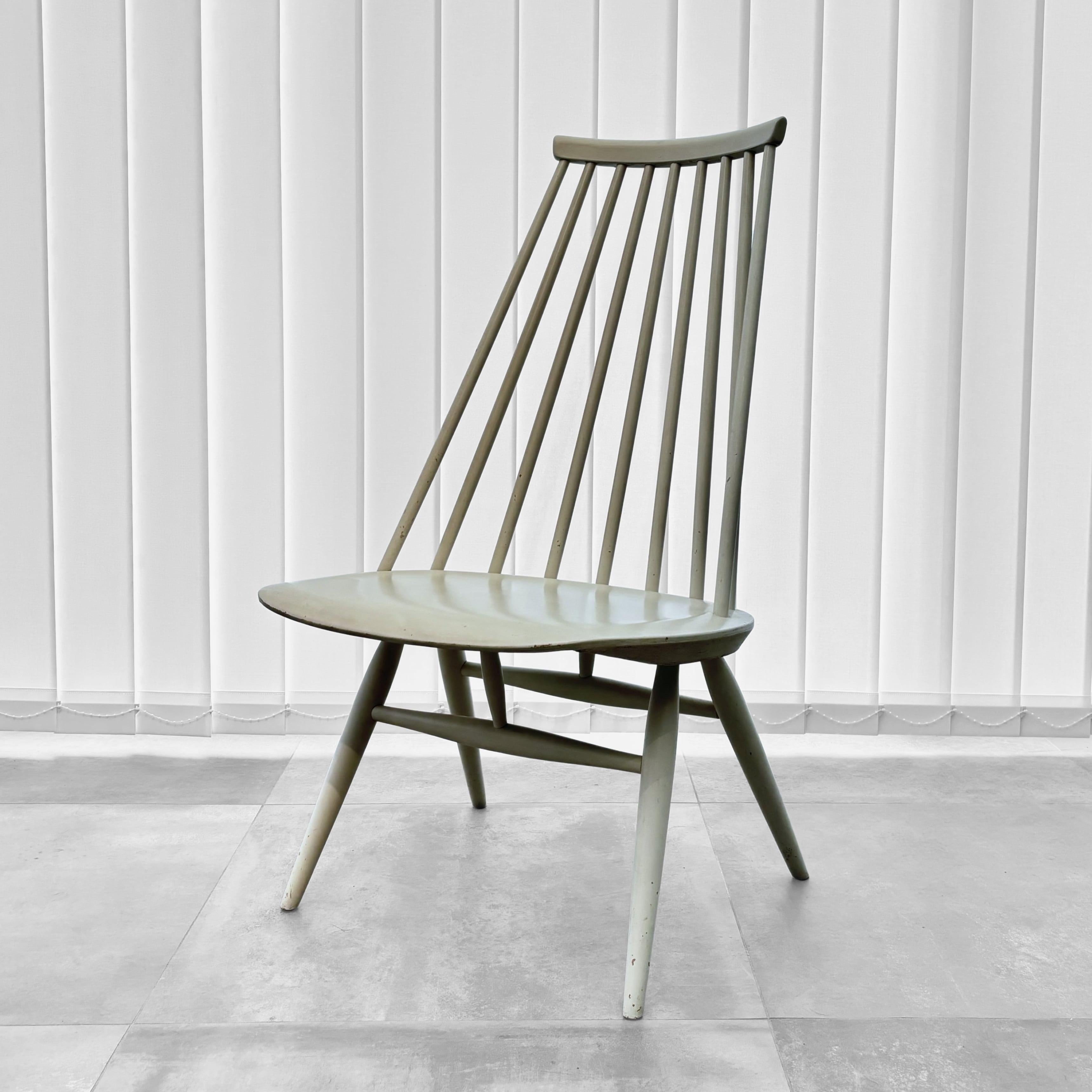 Mademoiselle easy chair designed by renowned Finnish architect Ilmari Tapiovaara for Edsbyverken, Sweden, 1956. This striking piece features solid beech dowels and a contoured plywood seat. Retains its original off-white finish with a beautifully