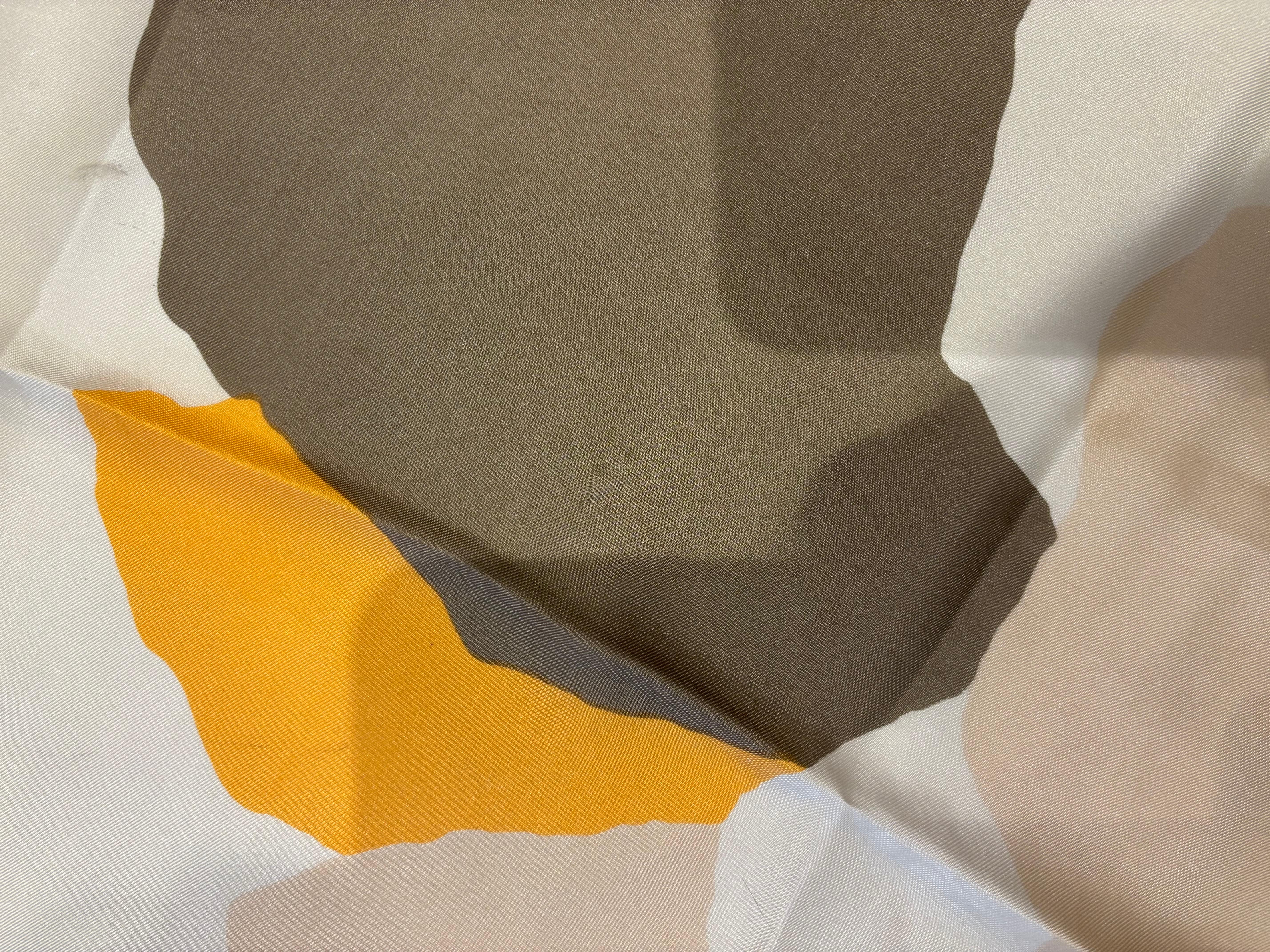 This is a lovely 1970s abstract Mademoiselle Ricci scarf in orange, cream and grey.
The hand sewn hems are grey and still plump.
There are a couple of minor spots on the scarf, therefore I have marked the condition good.
Perfect around the neck as a