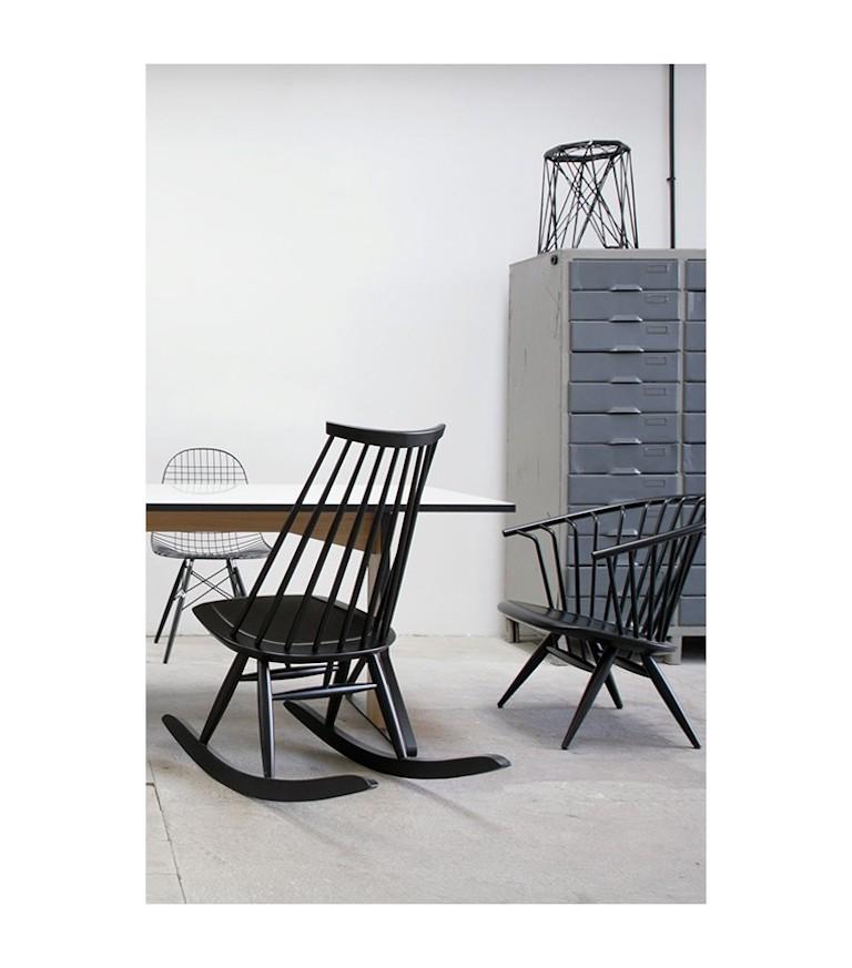 Mademoiselle Rocking Chair in Black by Ilmari Tapiovaara & Artek. The Mademoiselle Rocking Chair is made from solid birch and was specifically developed for the home. Crafted using an age-old construction method, the spoke back contrasts strikingly
