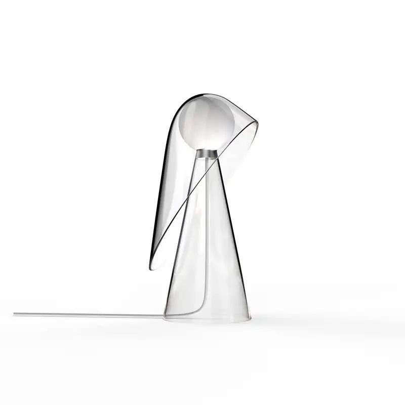 Lampe de bureau transparente Mademoiselle par Mason Editions
Conçu par Quaglio Simonelli.
Dimensions : Ø 21,8 cm x H 30 cm : Ø 21,8 cm x H 30 cm.
Matériaux : verre borosilicaté pyrex transparent.

Toutes nos lampes peuvent être câblées en fonction