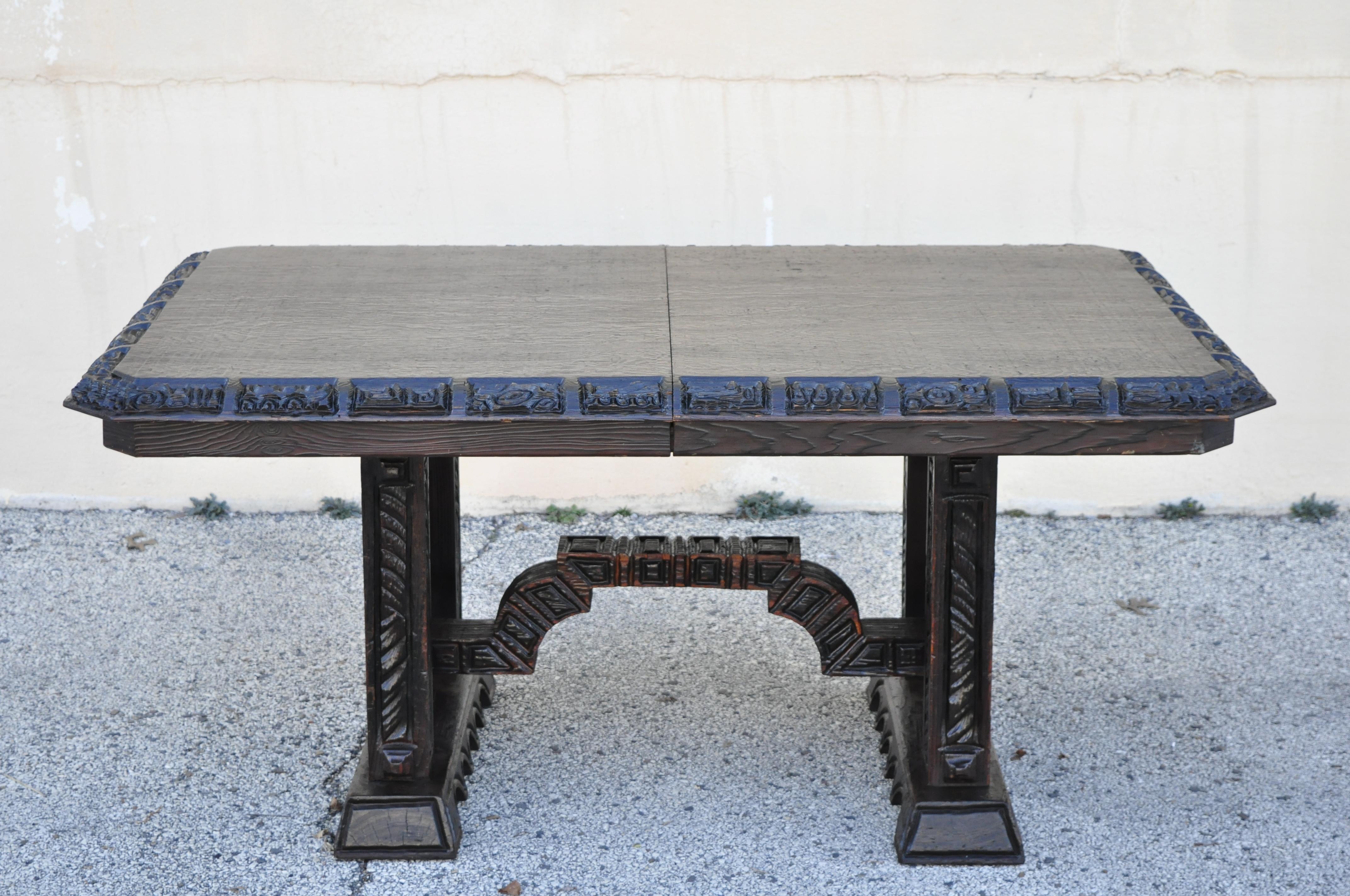 Maderas De Santa Barbara Gothic Revival carved wood Elvis jungle room style dining table. Item features shield and lion carved pedestal base, solid wood construction, distressed finish, quality American craftsmanship, great style and form. No table