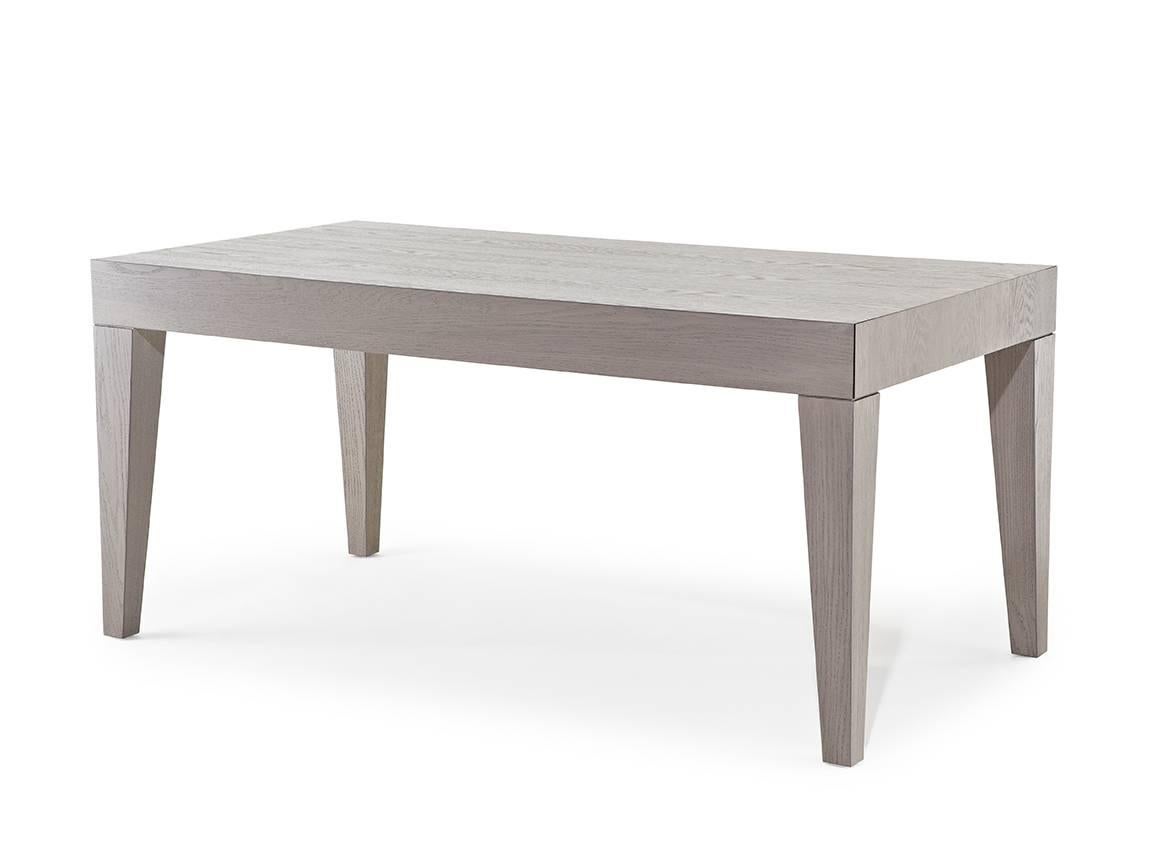 The Madison dining table is sophisticated with distinctive angled legs, offering a starkly modern dining option.