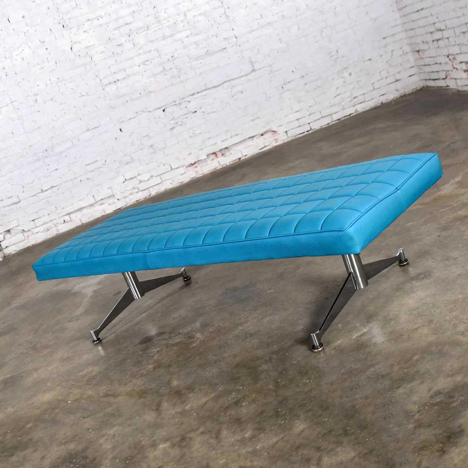Awesome Mid-Century Modern bench or daybed in the style of Arthur Umanoff for Madison Furniture Co. Comprised of the original turquoise vinyl faux leather with box stitching and chrome steel legs. In beautiful vintage condition. There is some sun