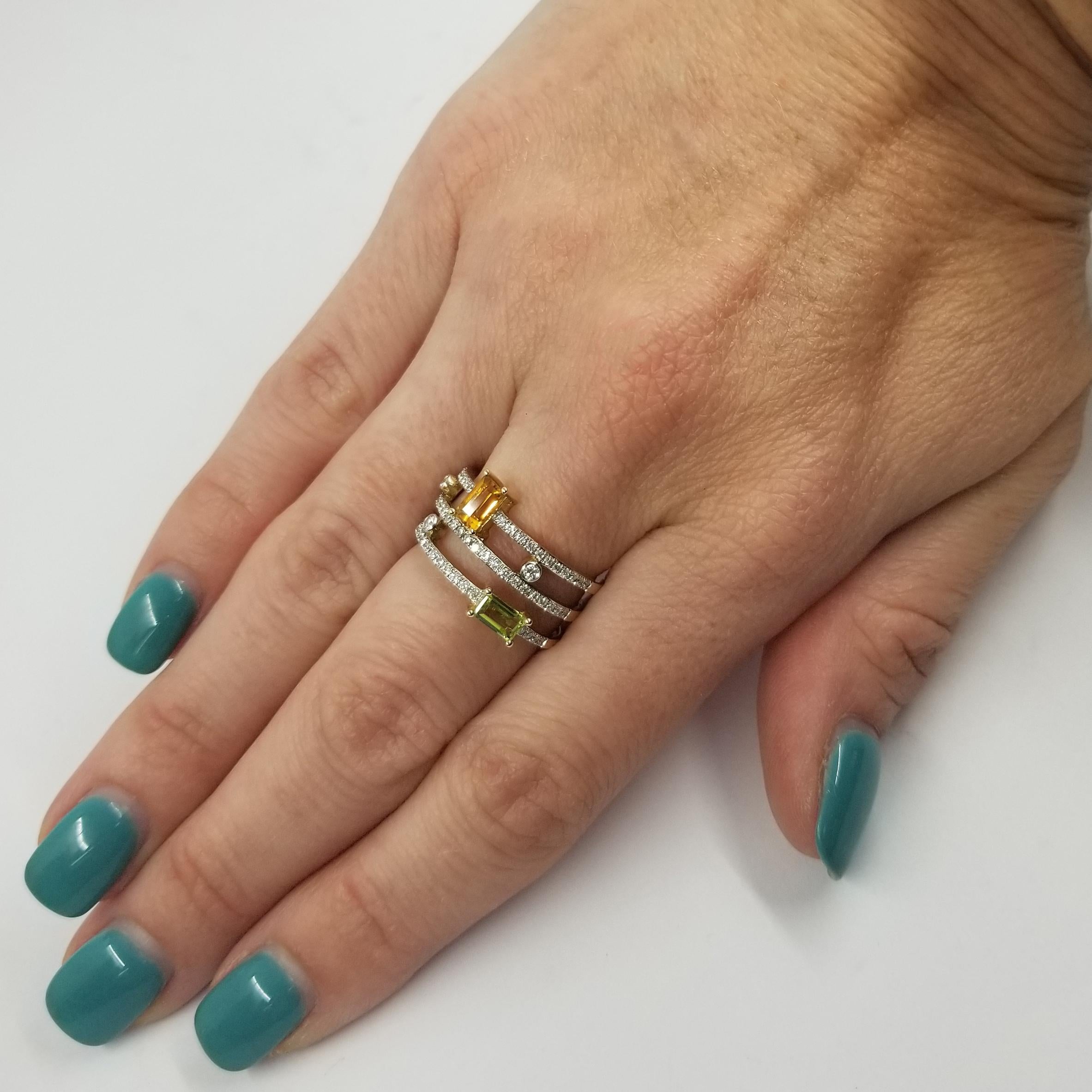 14 Karat Yellow Gold Fashion Ring From Madison L. Featuring A 0.31 Carat Emerald Cut Peridot, A 0.33 Carat Emerald Cut Citrine, & 60 Round Diamonds Totaling 0.33 Carats. Finger Size 6.5.