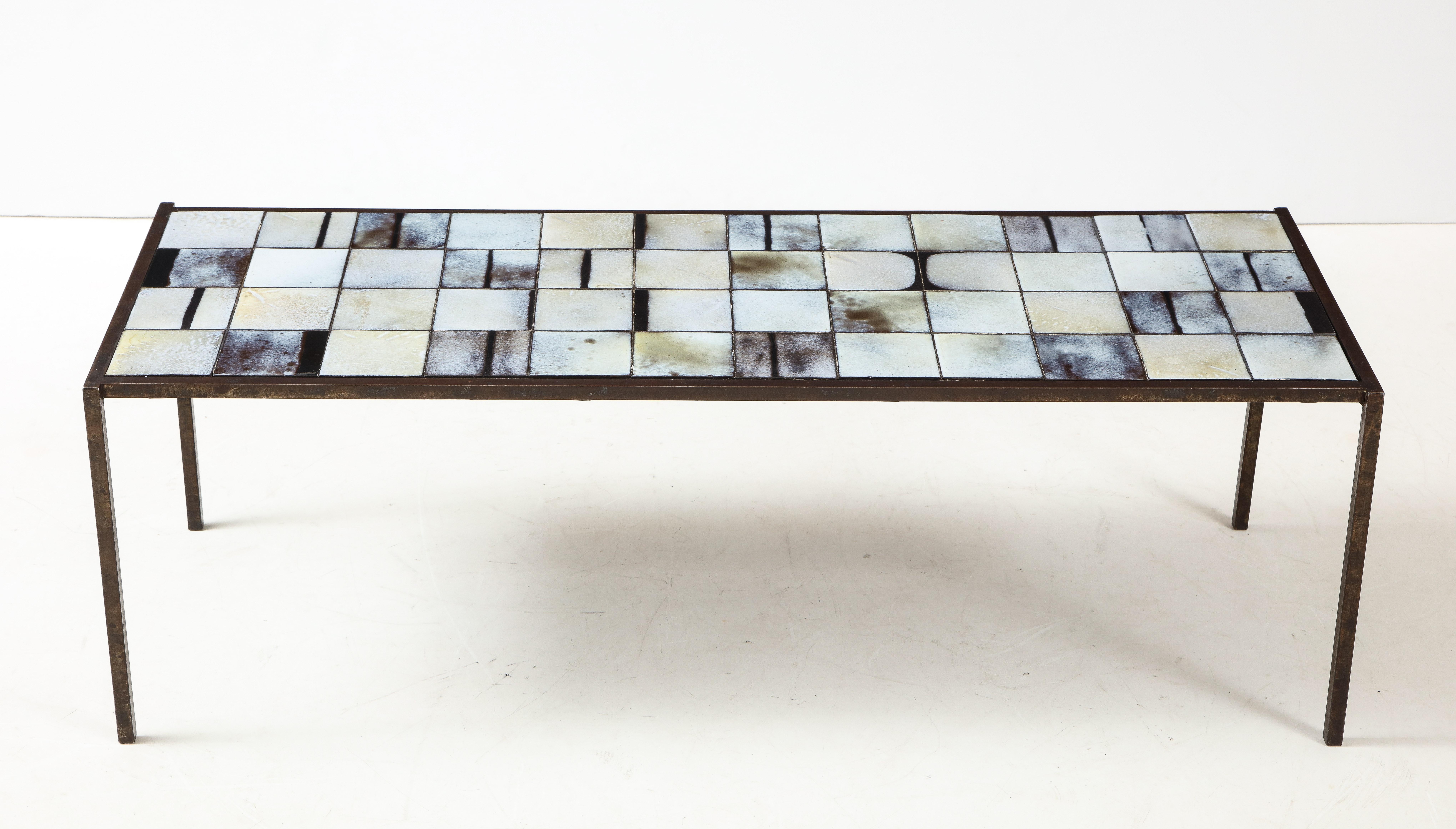 Mado Jolain (b. 1921, France) 
Ceramic tile and iron coffee table, circa 1950s
Measures: H 16, D 18, W 48.5 in.

Atelier Mado Jolain, Réne Legrand
