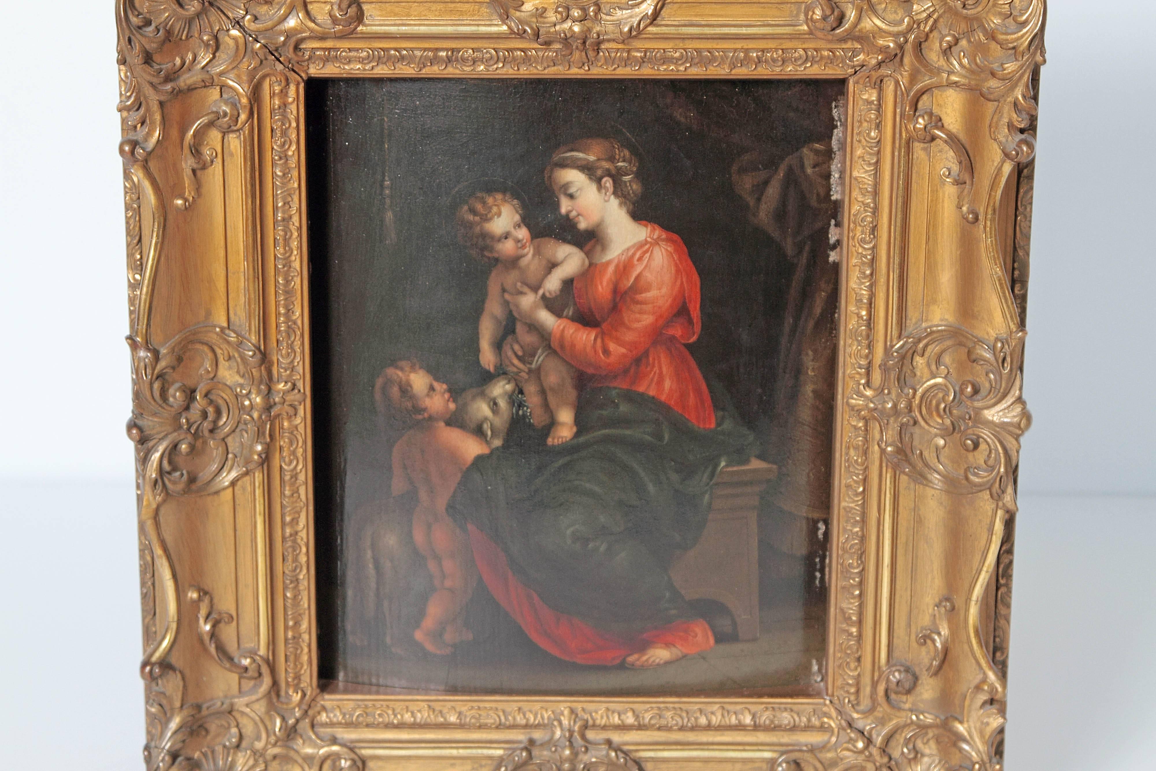 Catholic picture / religious painting / Christian oil on board, framed in an elaborate gilded frame, carved with gesso, the Madonna and Child (the Virgin Mary and Jesus / the Christ child) with the infant St. John the Baptist and the Lamb, the lamb
